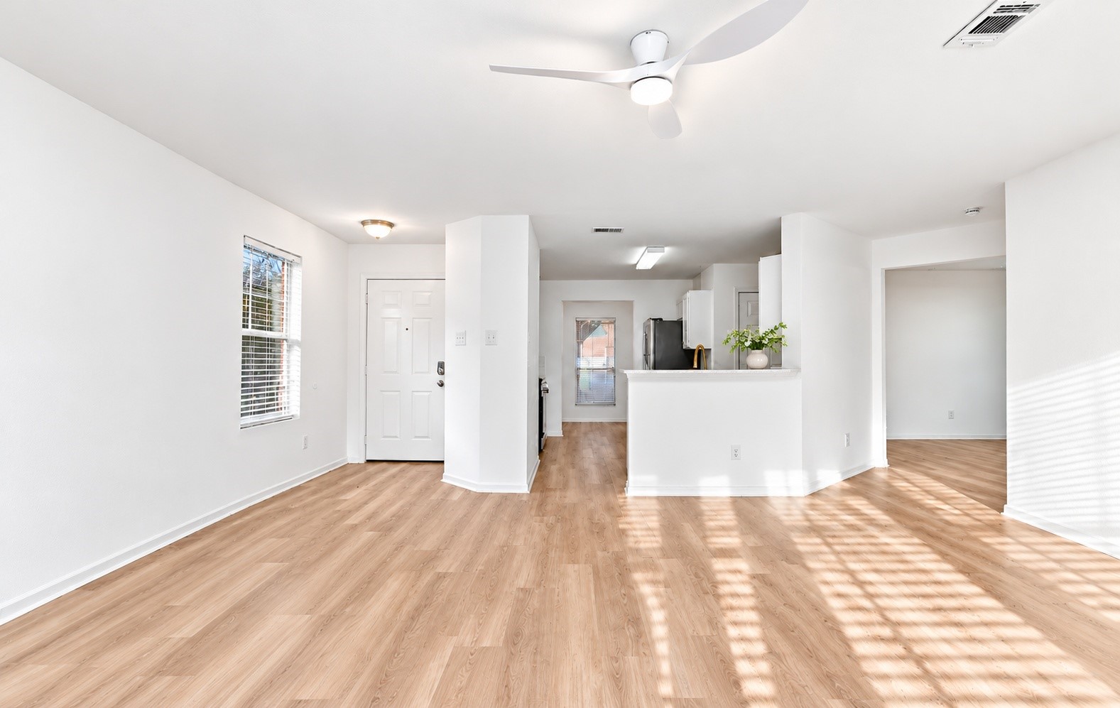 Another angle of the living room into the kitchen!