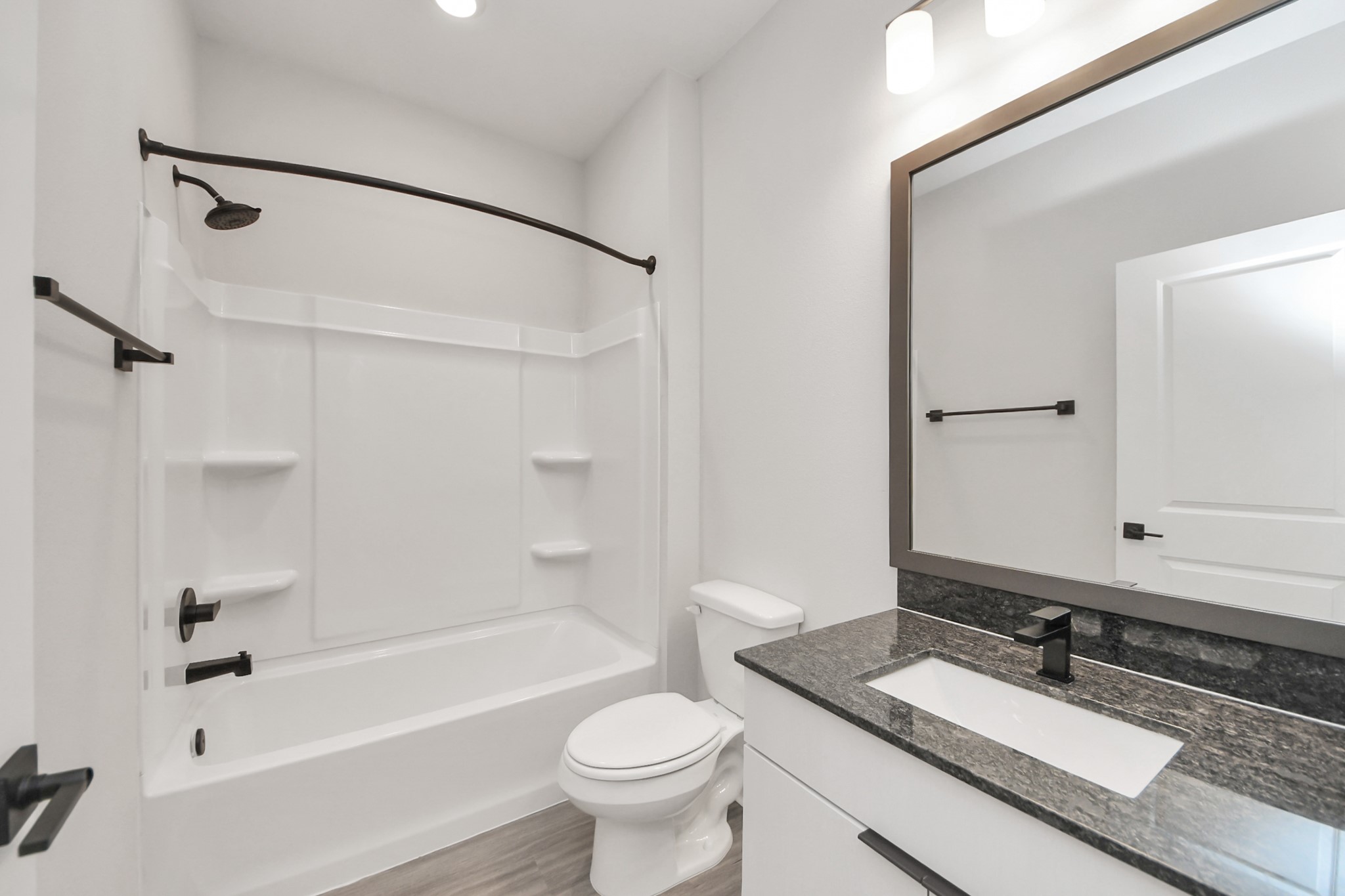 Full Bathroom with granite counters