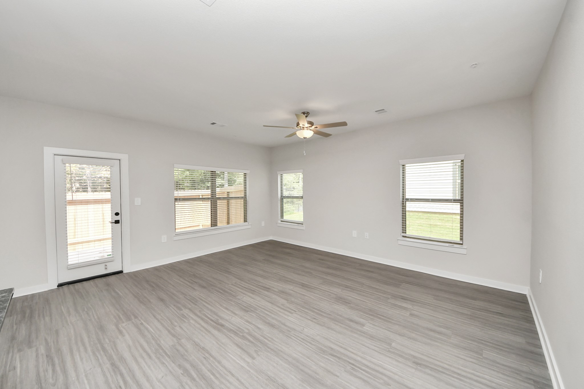 Boasting luxury finishes-stylish Island kitchen,granite counters,subway tile backsplash,ample custom cabinet space,stainless appliances,refrigerator,full size washer&dryer included,wood-like floors throughout,open concept floor plan.