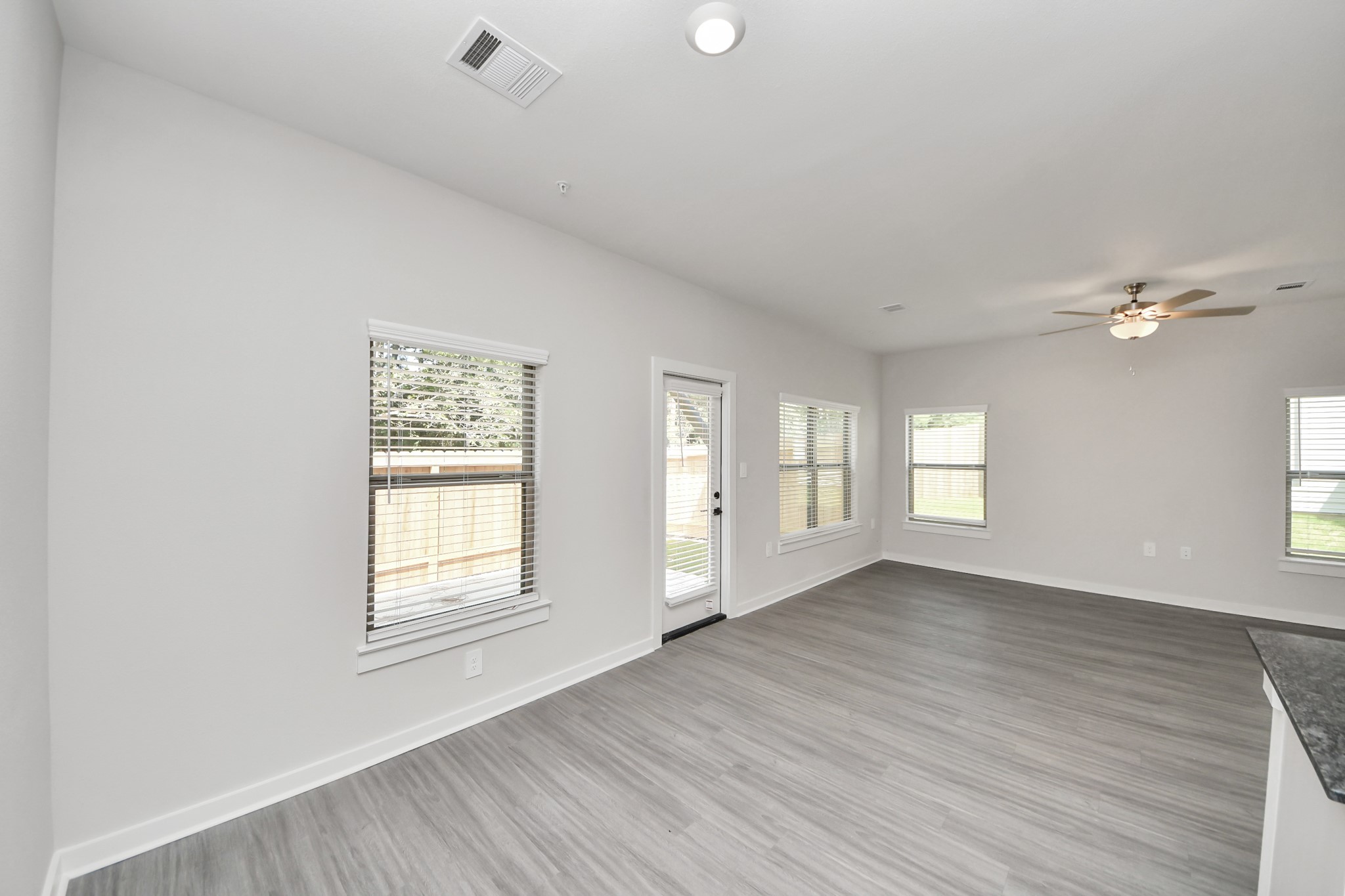 Boasting luxury finishes-stylish Island kitchen,granite counters,subway tile backsplash,ample custom cabinet space,stainless appliances,refrigerator,full size washer&dryer included,wood-like floors throughout,open concept floor plan.