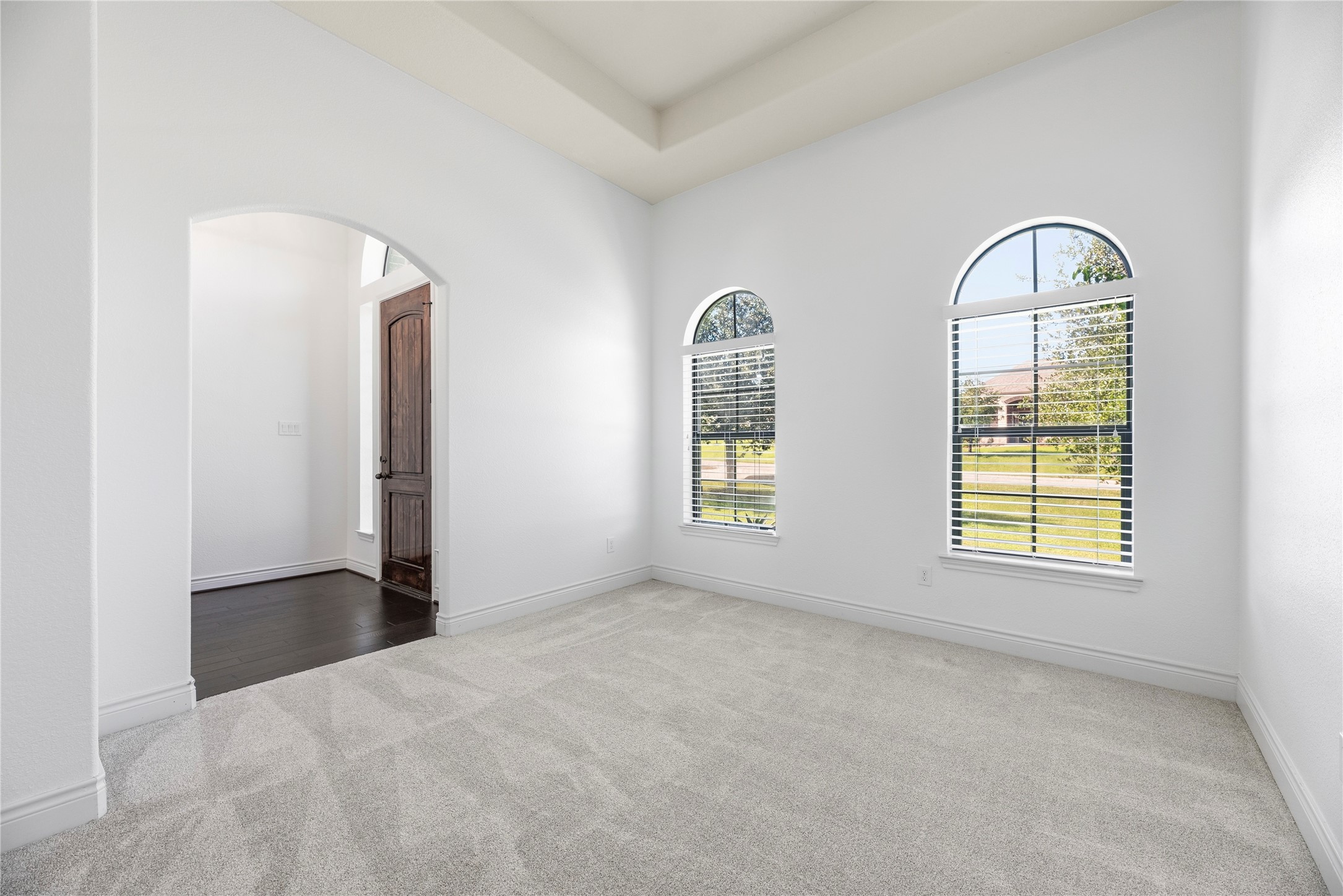 Versatile home office is just off the entry.