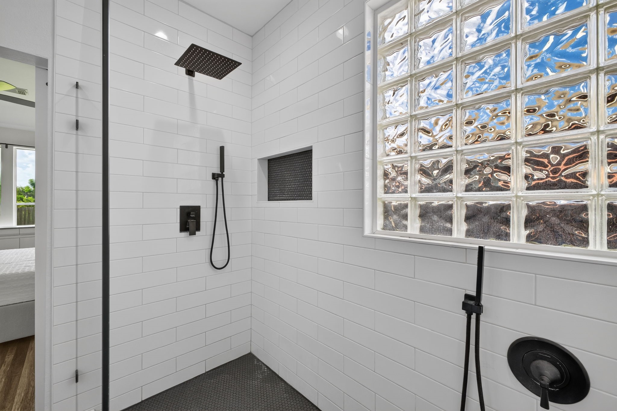 Oversized shower with rainfall shower head