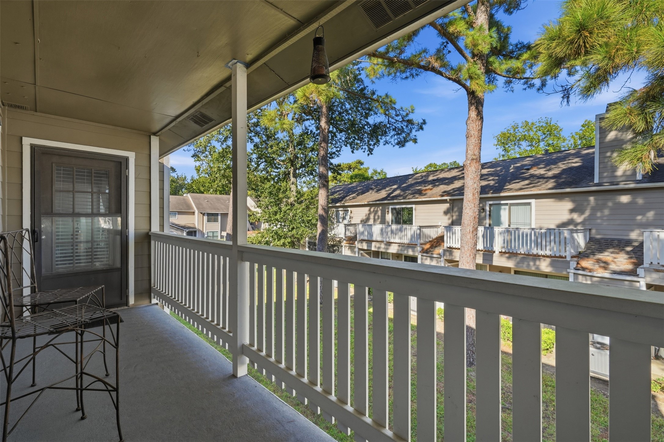 Enjoy the covered balcony with convenient access from both the living room and primary bedroom.