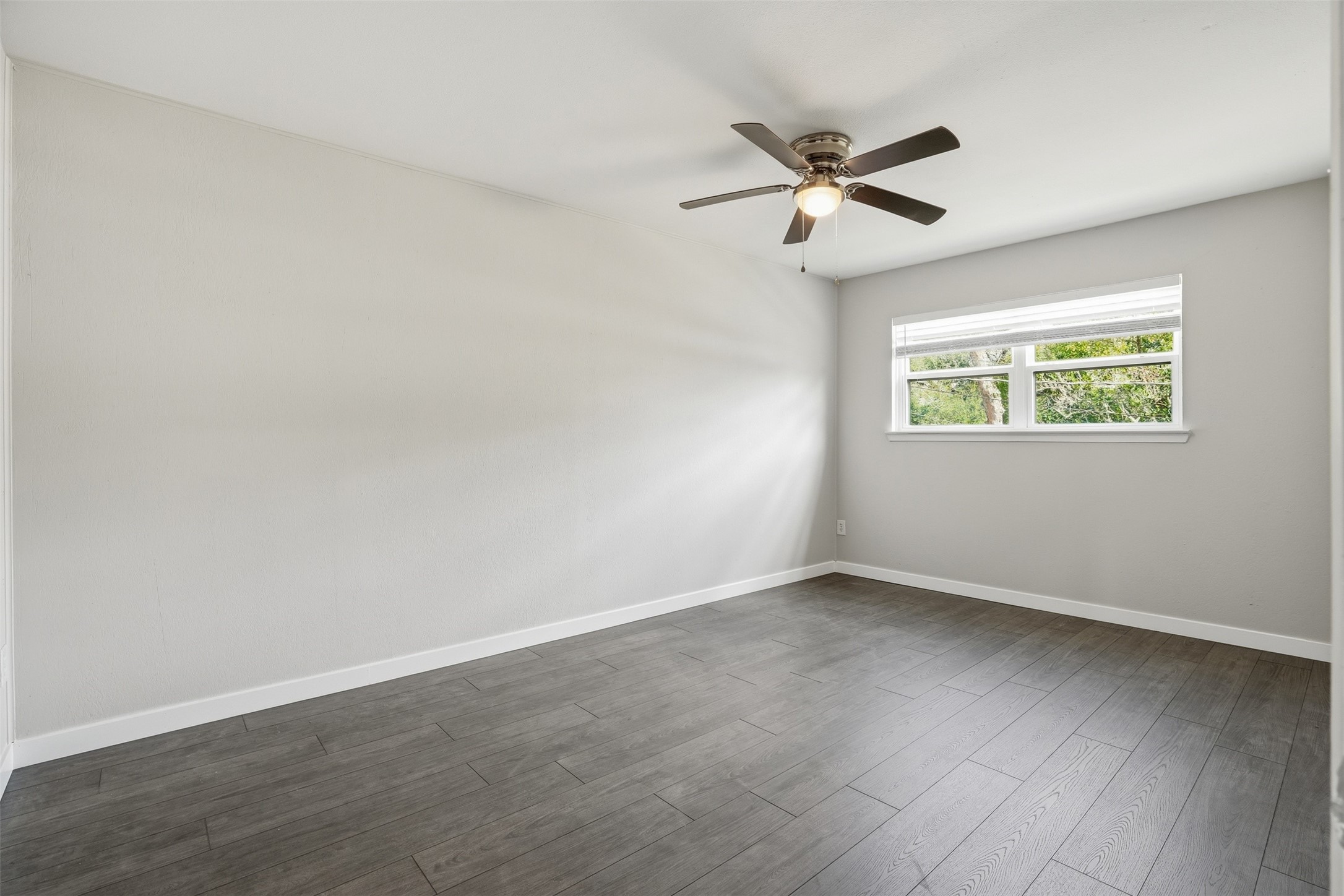 Cozy primary suite offering privacy and a peaceful retreat.