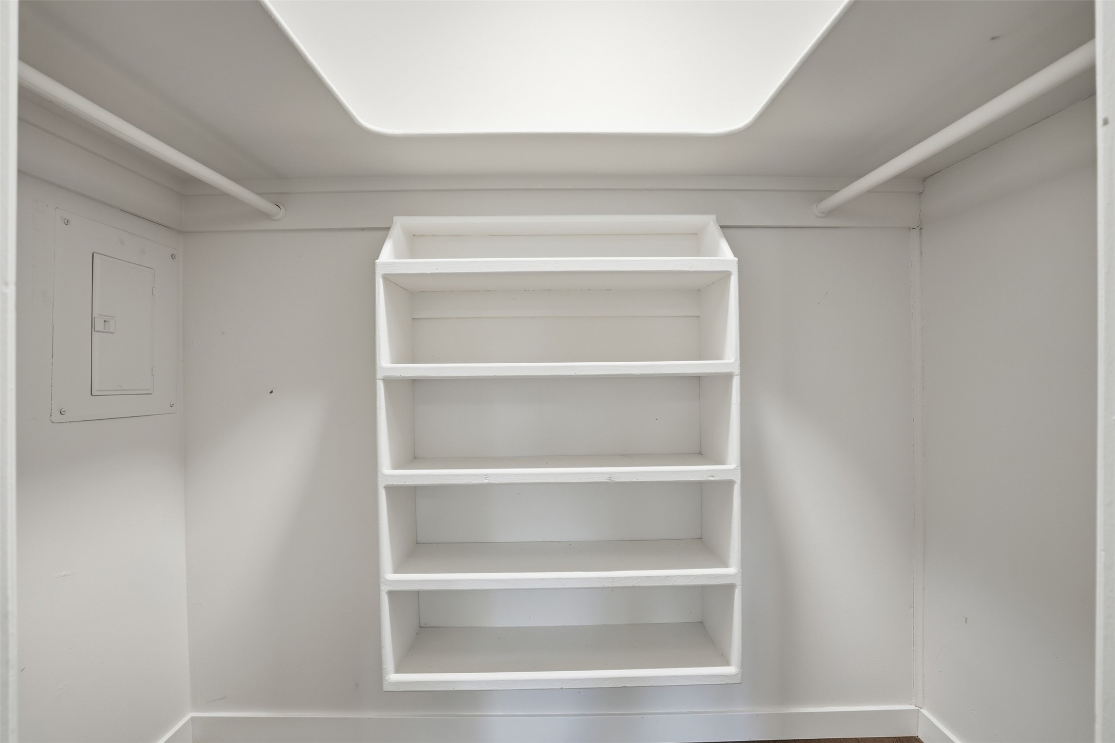 Spacious closet featuring built-in storage solutions for clothing and accessories.