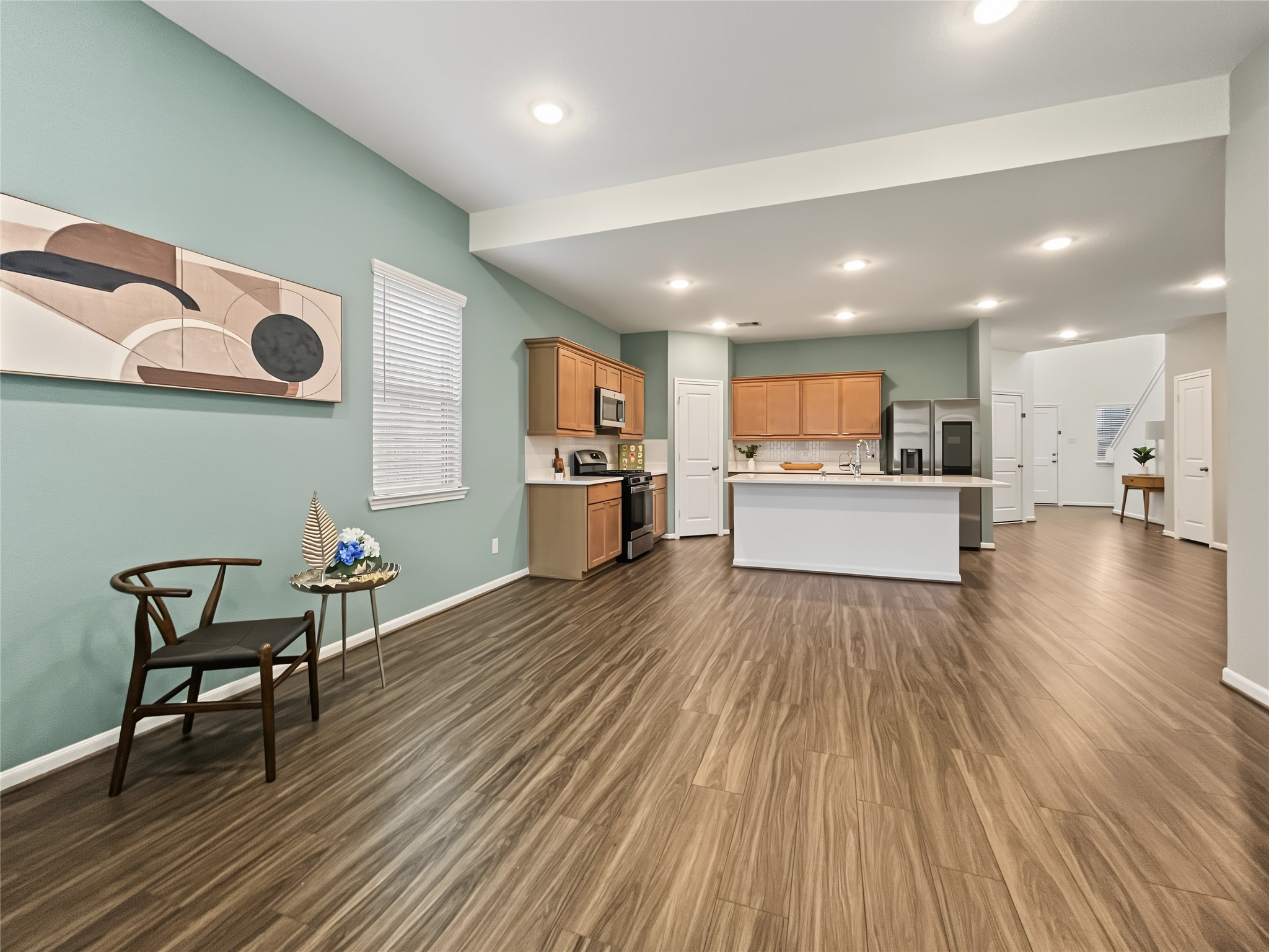 Great view from the living room to the open kitchen to the social areas.