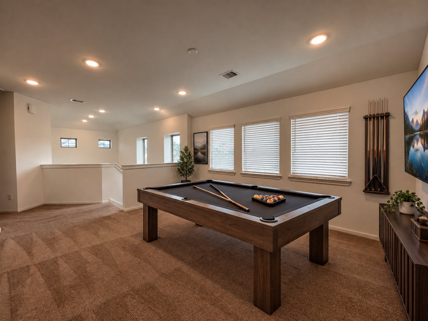 View of the virtually staged gameroom perfect for leisure.