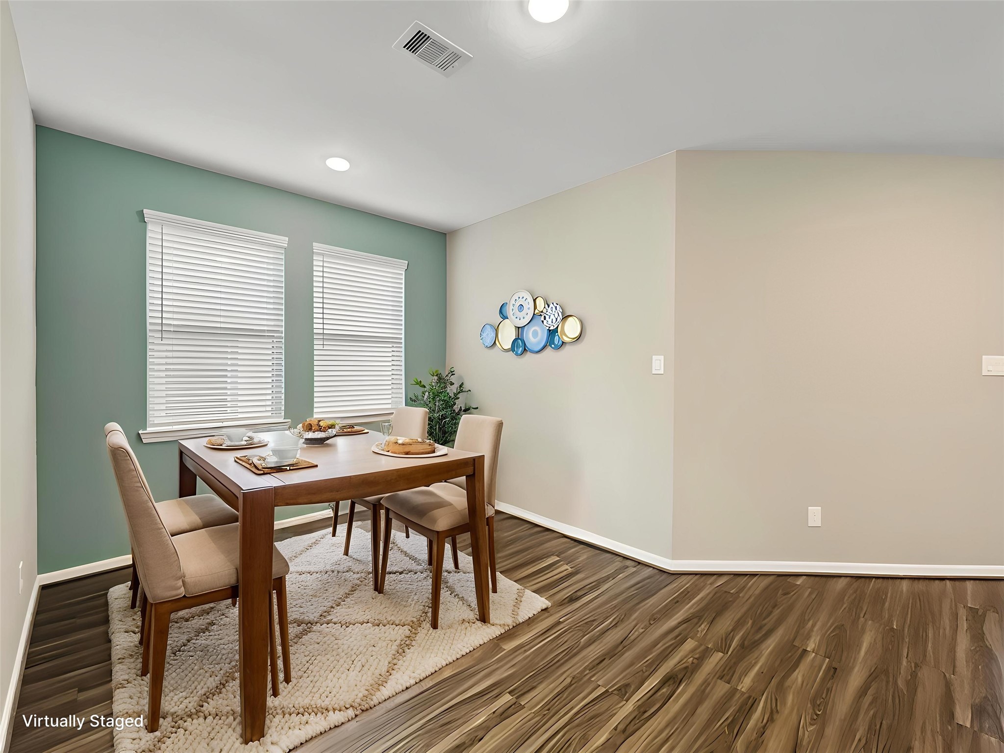 View of the dining room virtually staged.