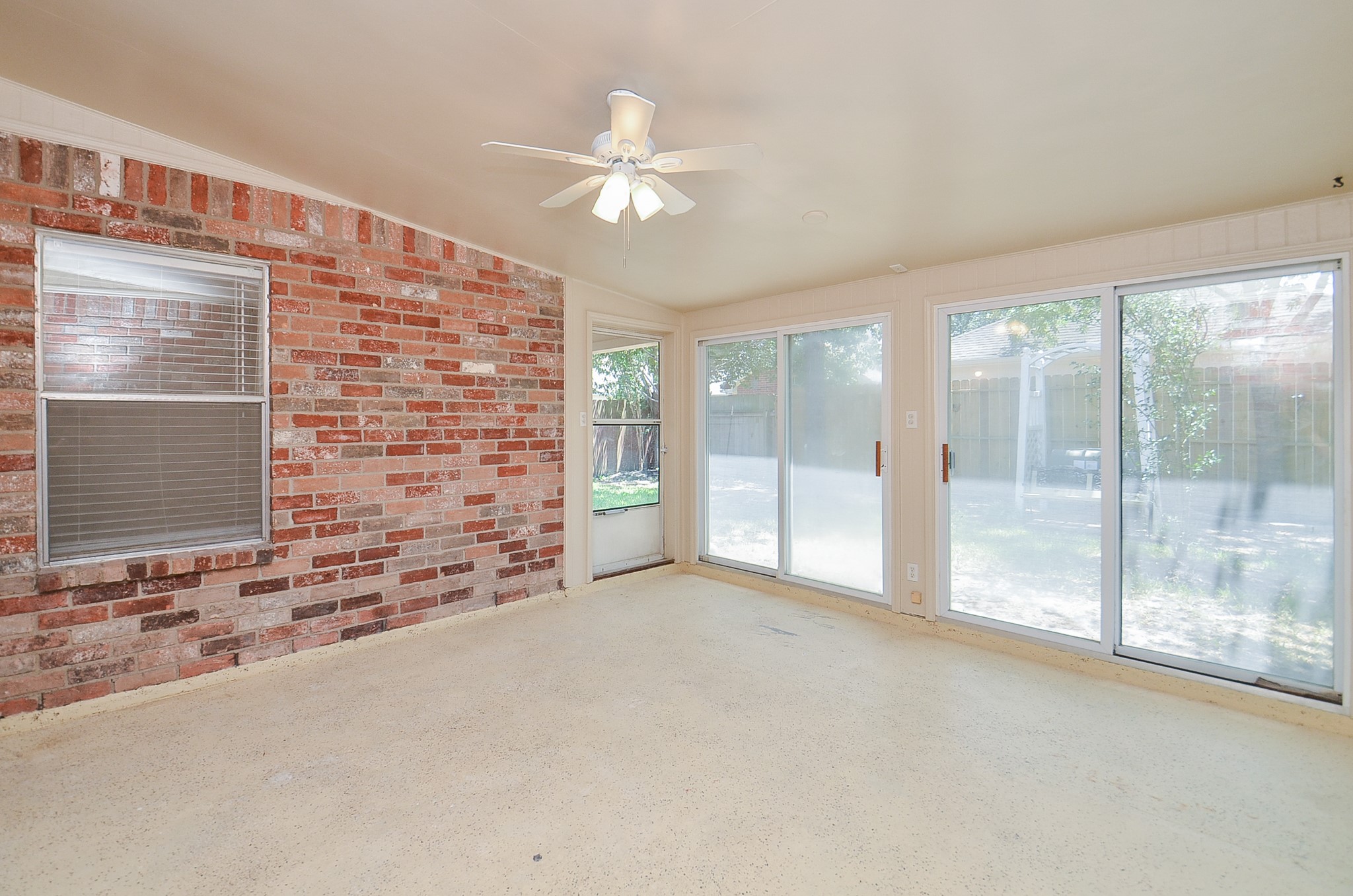 Enjoy your time in this enclosed patio with sliders.