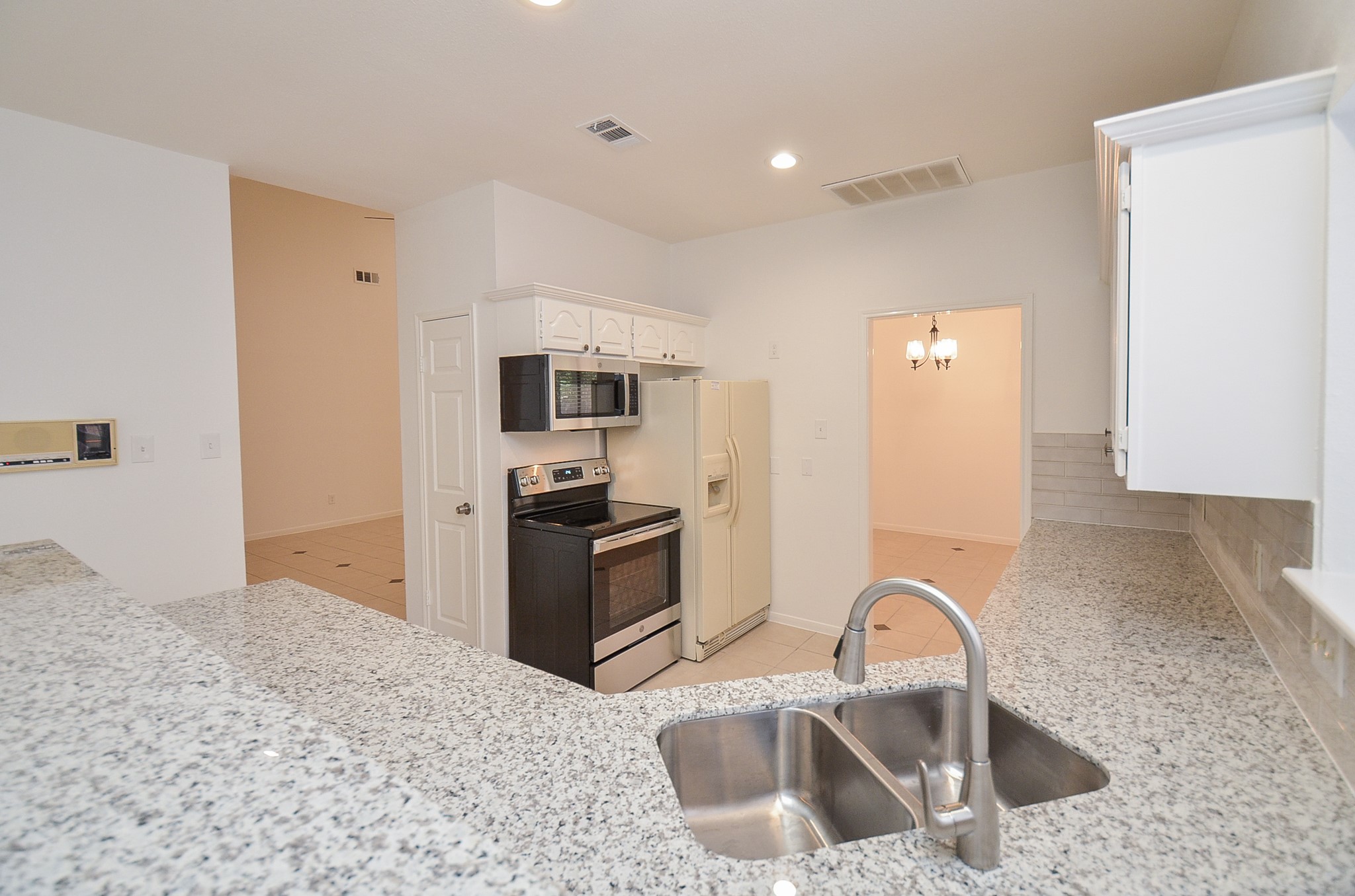 View into the family room and formal dining room.