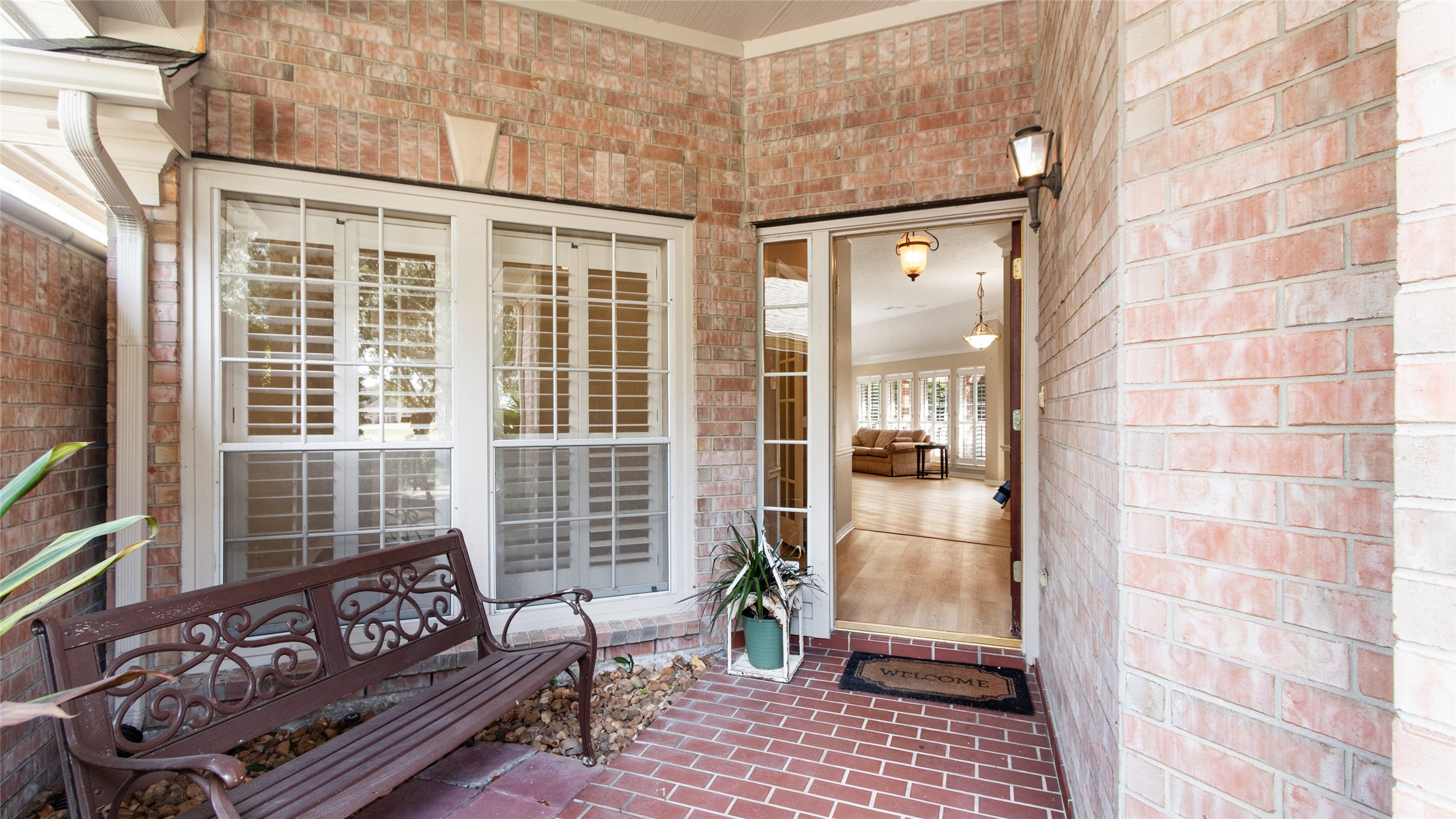 Covered front entry with charm.