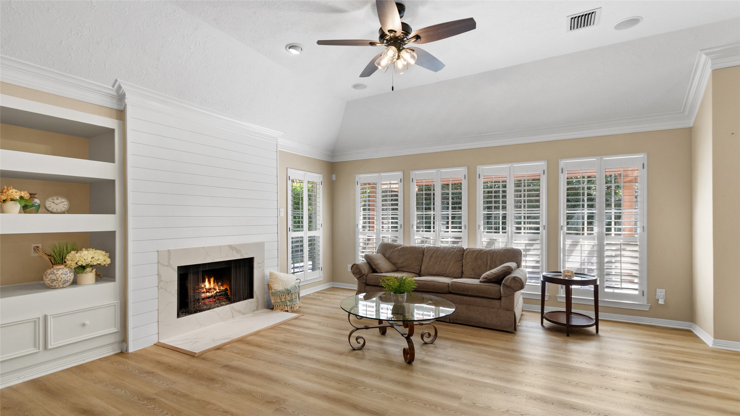 Gather with friends and family in this inviting living space by the fireplace.