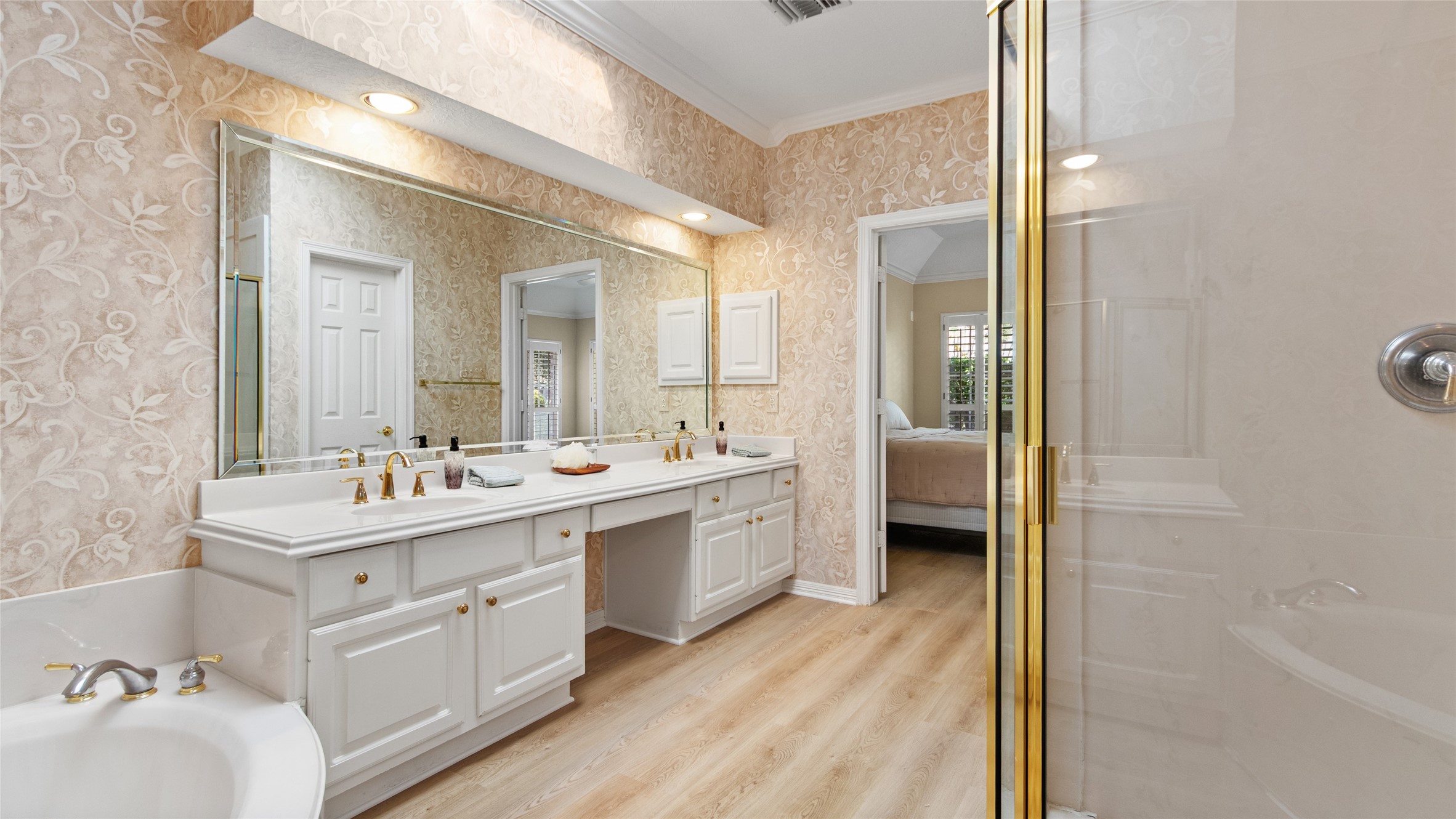 Primary offer private bathroom toilet with linen closet.