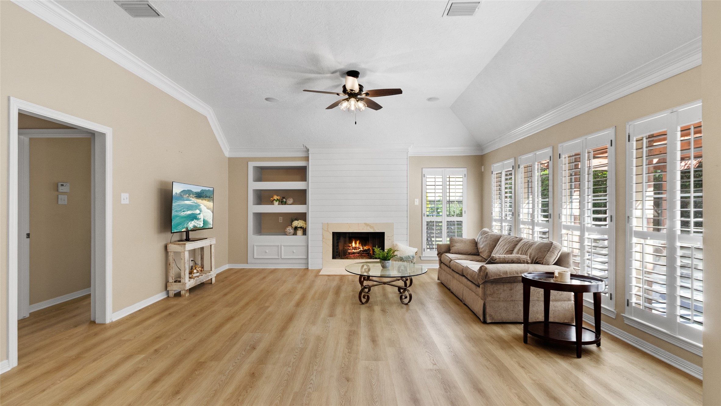 Stunning fireplace with shiplap and elegant quartz finish.