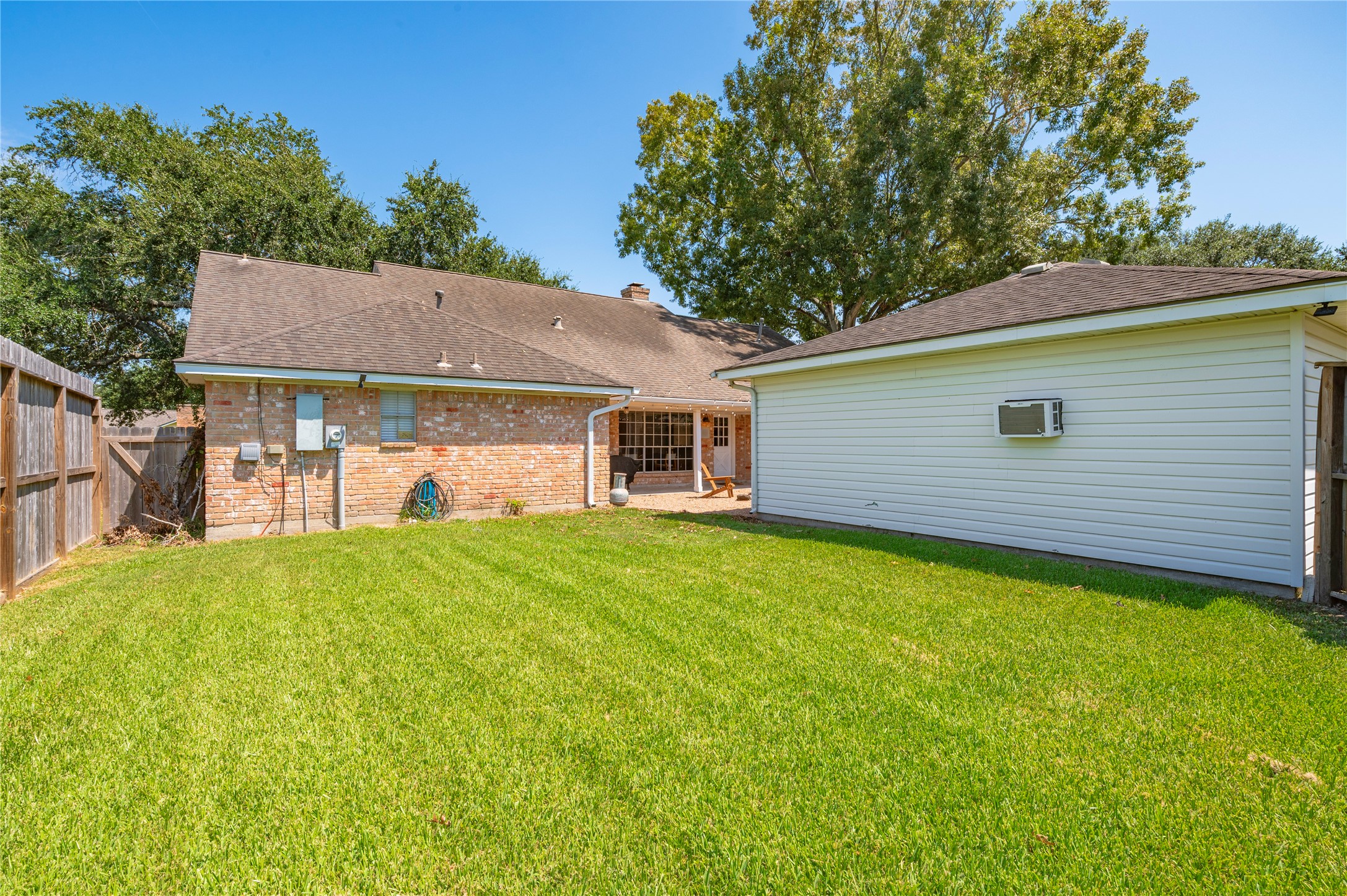 Another view of the large backyard of the home.