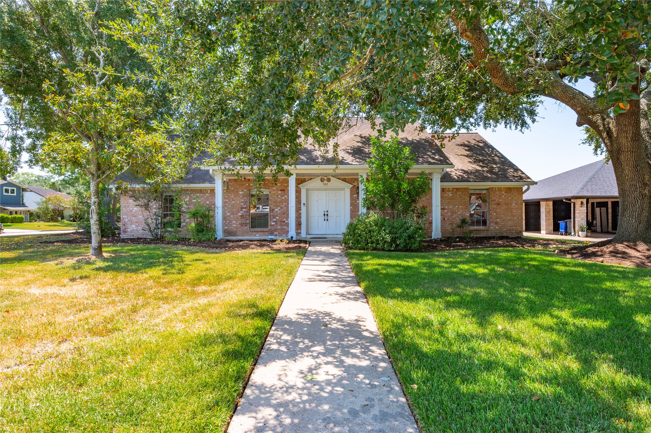 Large frontyard with mature tree gives the home great curb appeal.