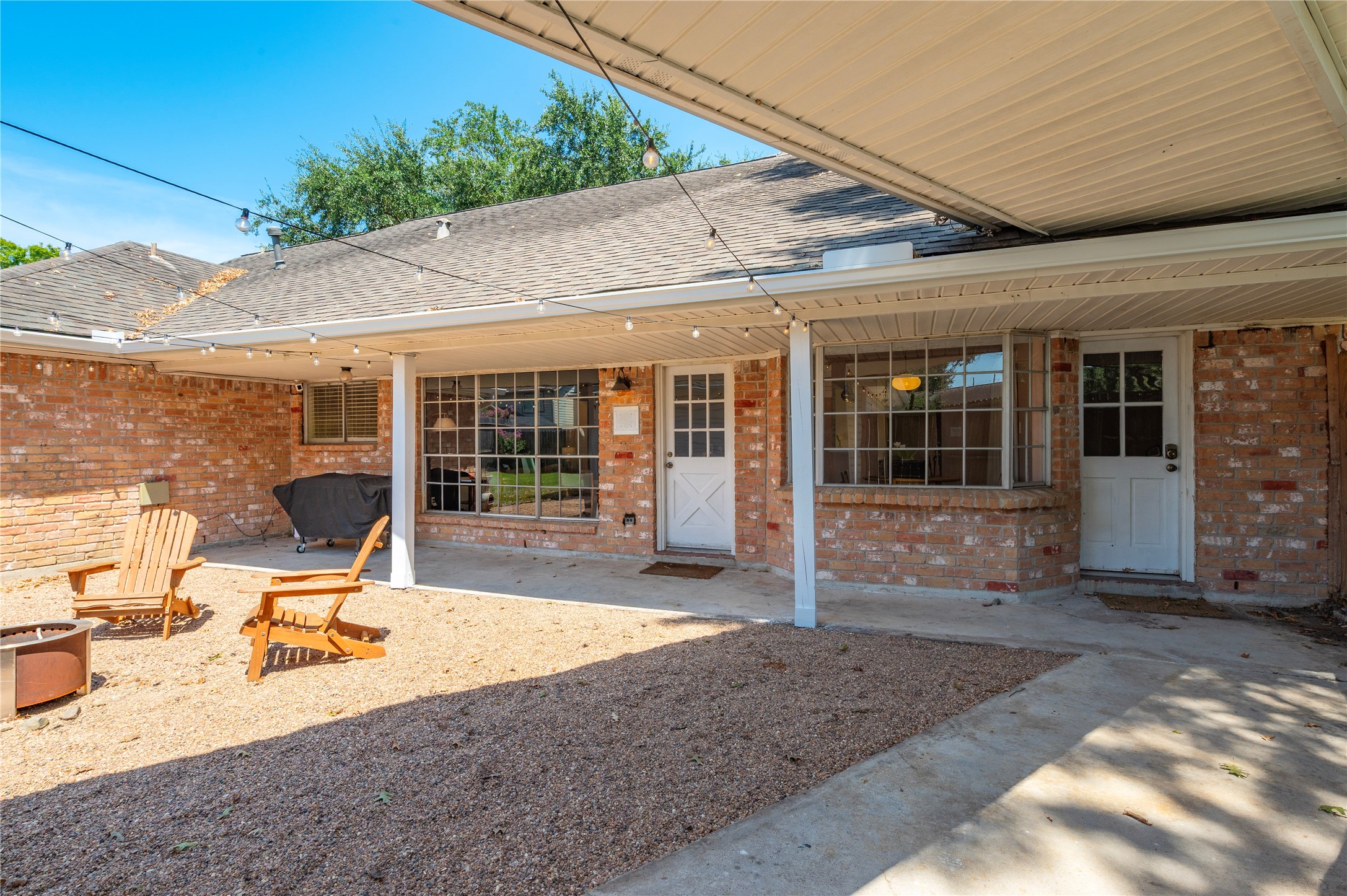 Lots of covered patio space with covered walkway leading from the garage to both back doors.