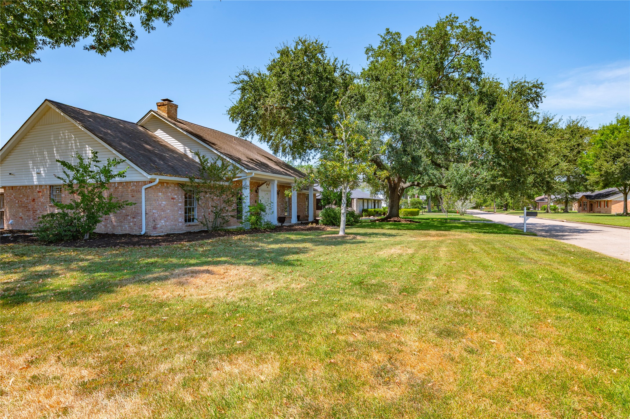 Another view of the large front yard of the corner lot property.