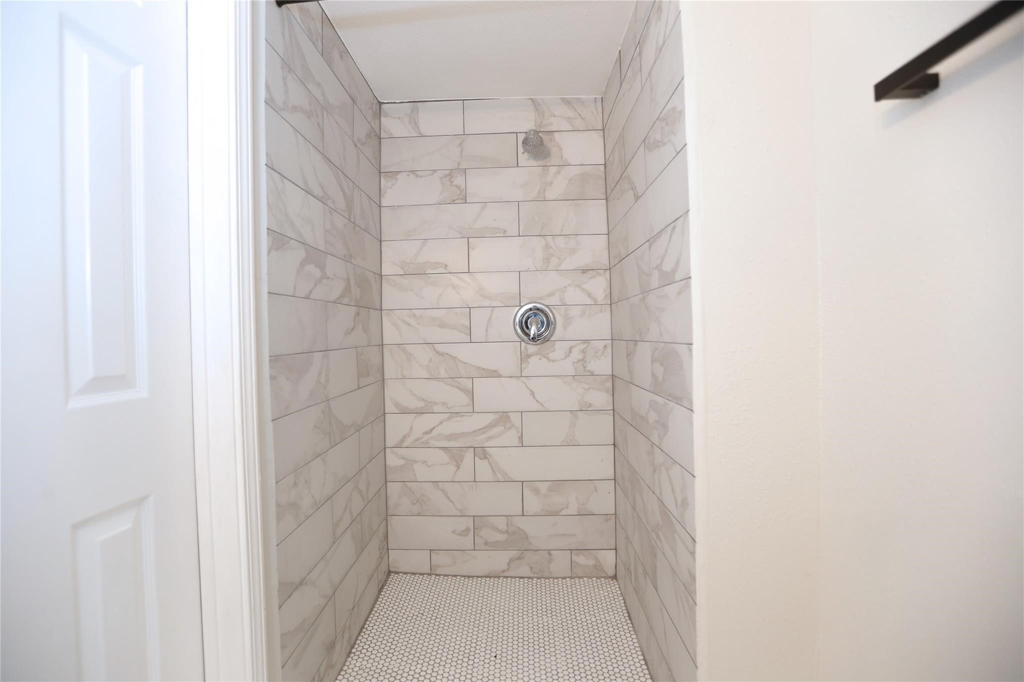Standing showed in the bathroom.