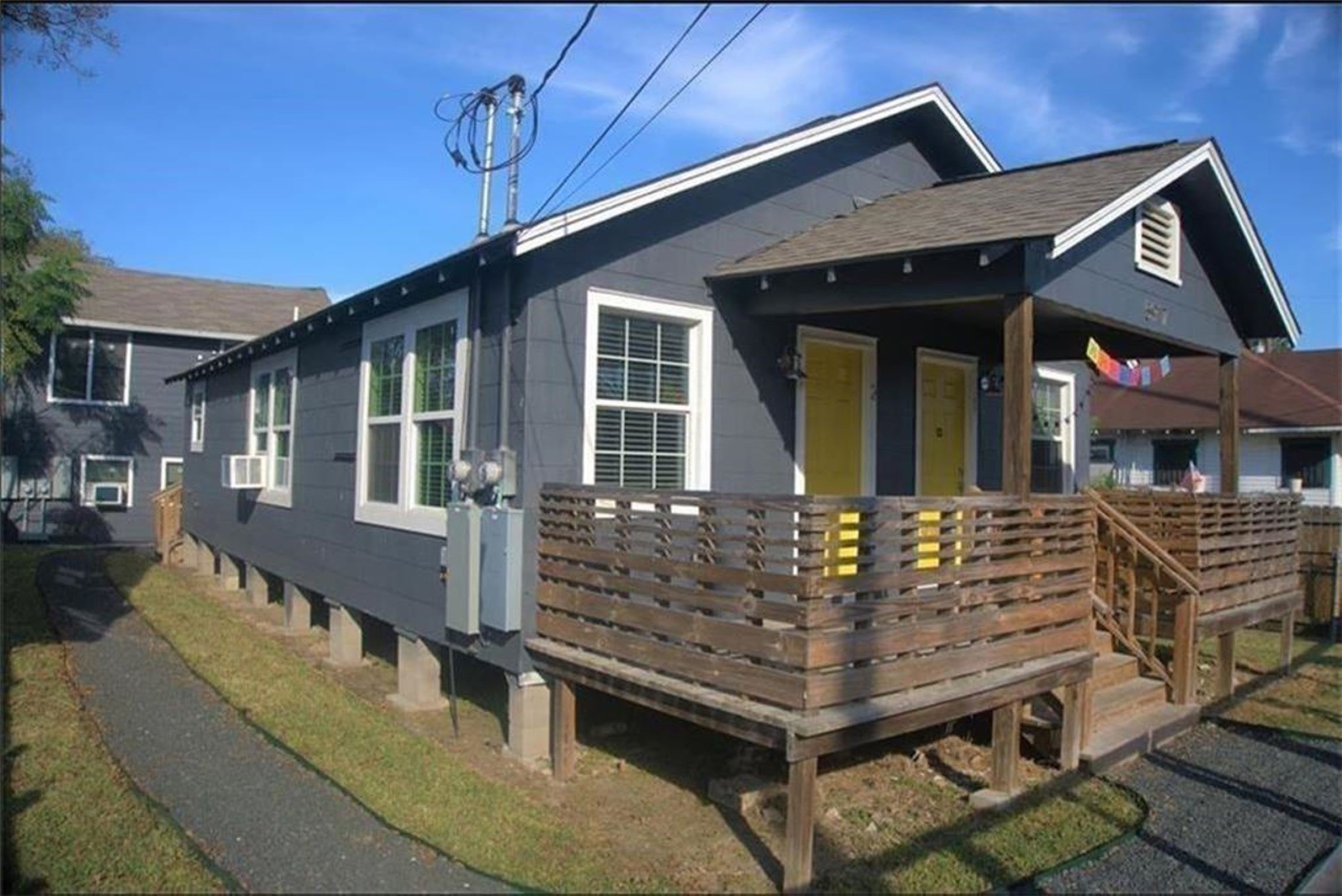 Entrance takes you through the front duplex to the back one where the unit is located. Lawn maintained by landlord.