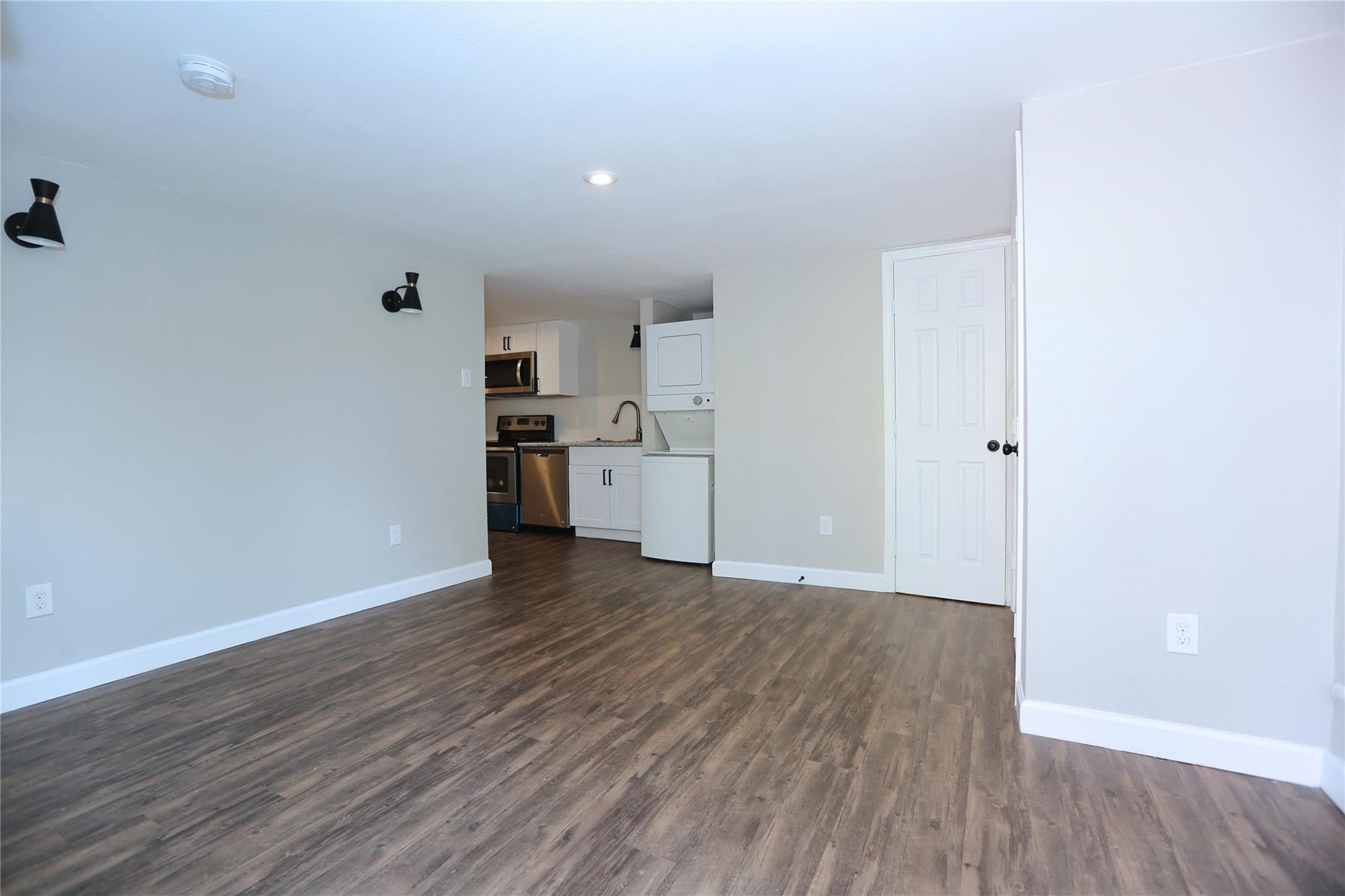 Welcomed by nicely done living room with storage area on the right, kitchen on the left and bathroom straigh ahead.