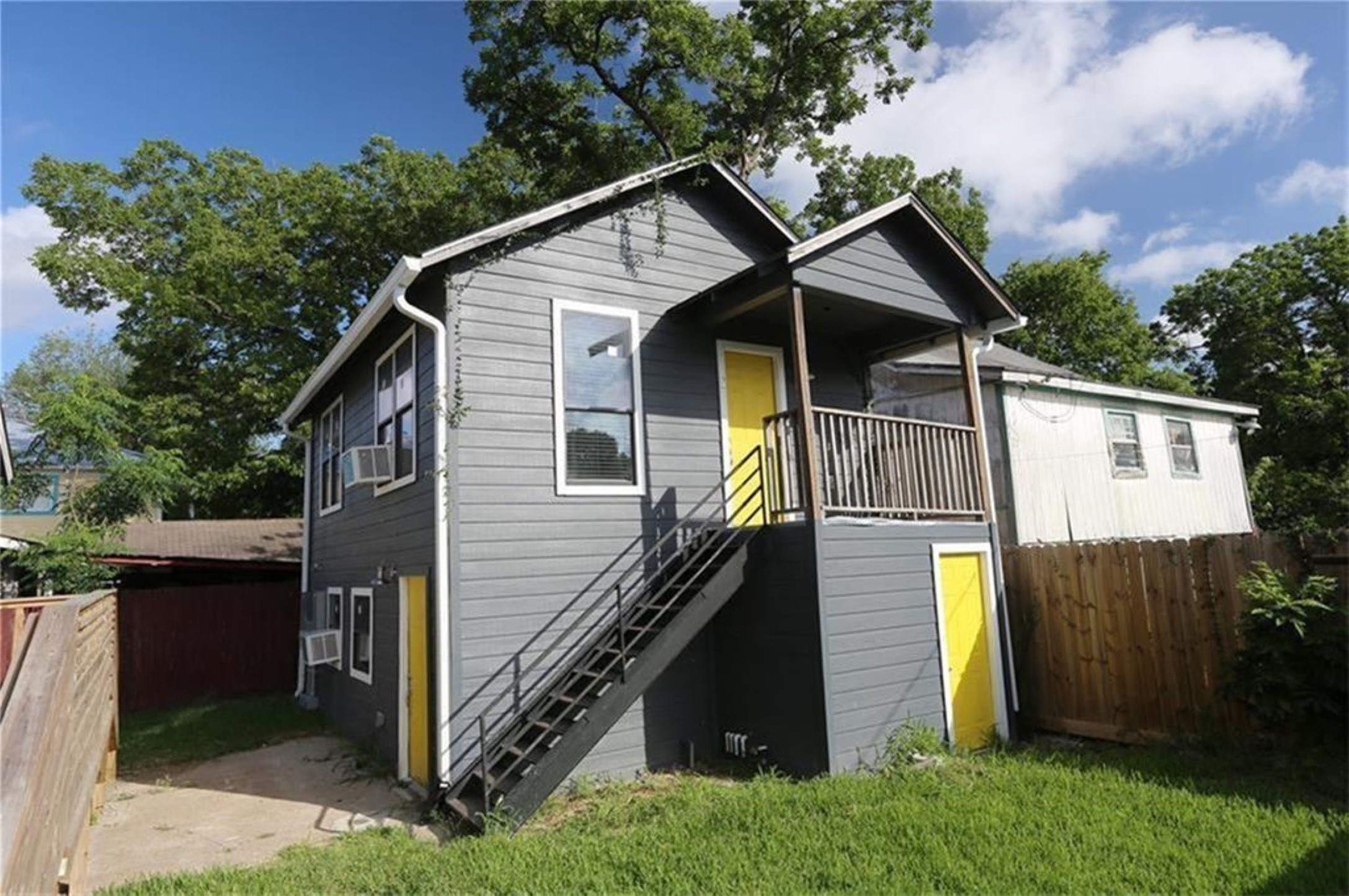 Stacked duplex unit in the back with the one up for rent being the bottom one.