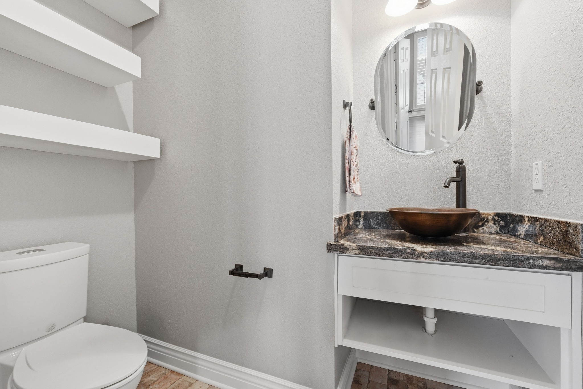 Convenient half bath located just off the living room.