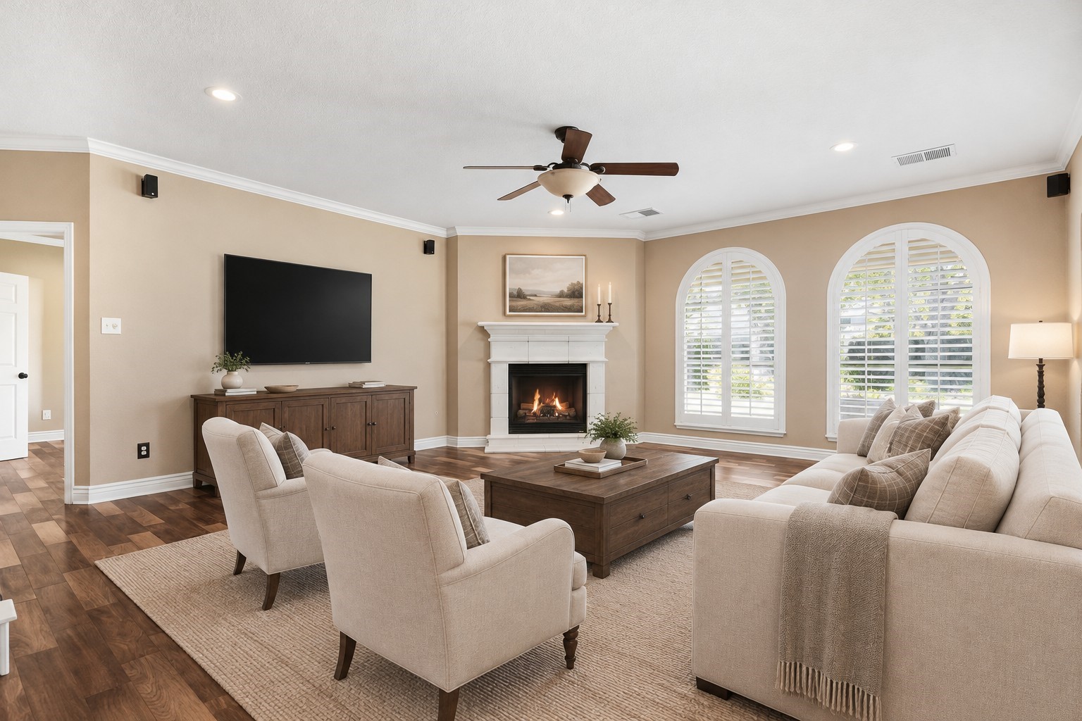 Arched windows and a gas fireplace create a warm, inviting living space. *AI staged*
