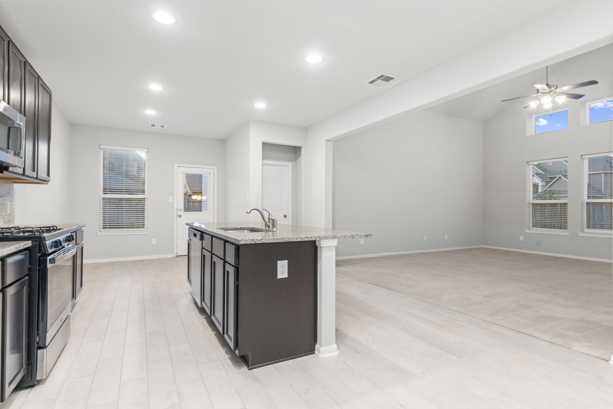 Kitchen flows seamlessly into the open concept Living Room
