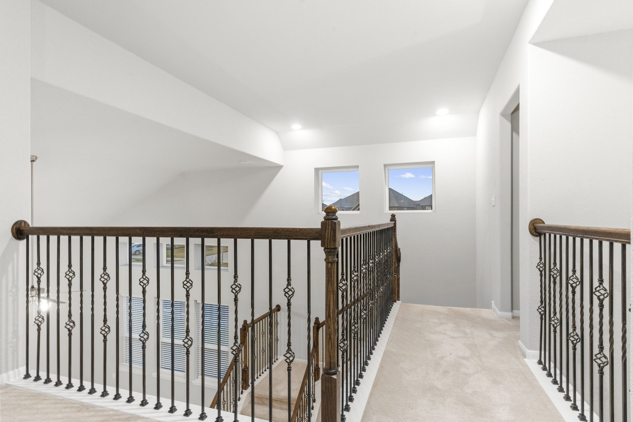 Coming up the elegant staircase onto the Gameroom Upstairs