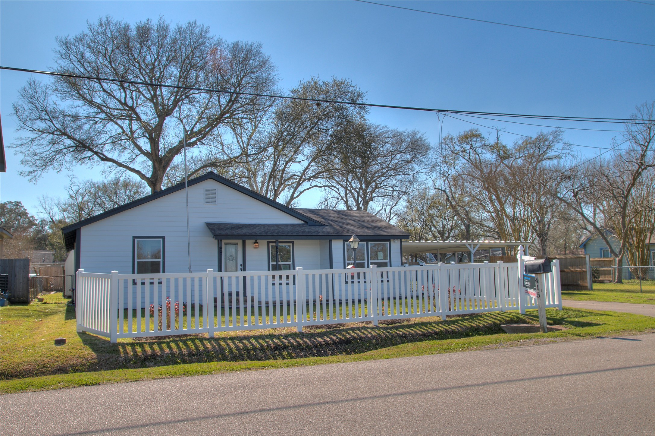 Stylishly renovated one-story home with charming white picket fence. Perfect blend of modern comfort and classic appeal. Stylishly renovated one-story home with charming white picket fence. Perfect blend of modern comfort and classic appeal.