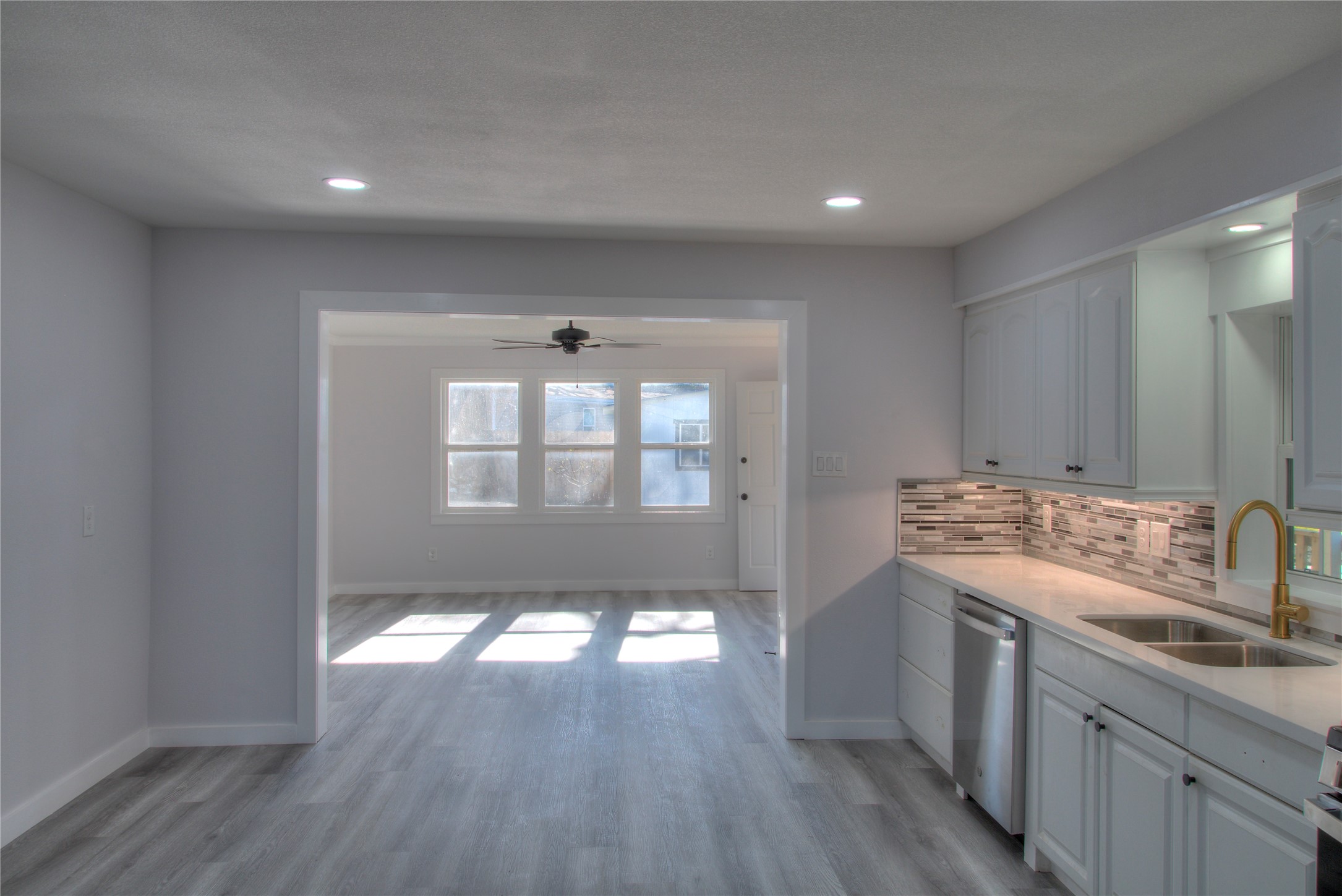 Open Kitchen Overlooking a Bright, Spacious Dining Area Open Kitchen Overlooking a Bright, Spacious Dining Area