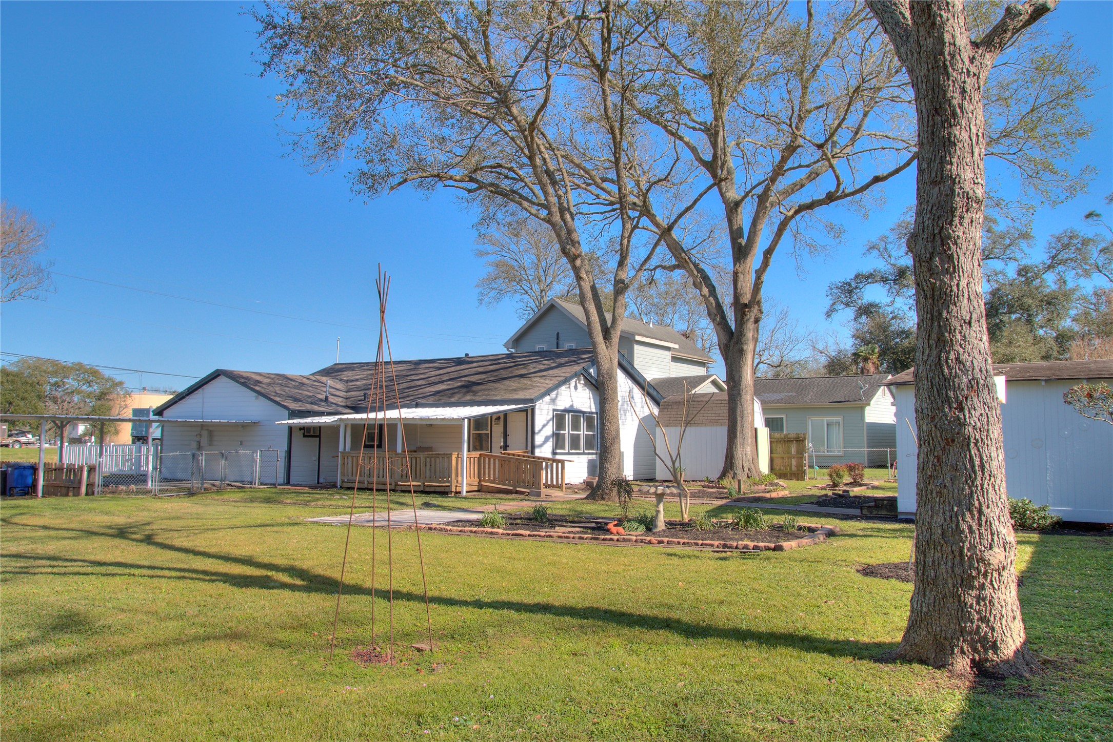 Enjoy the serene backyard with mature trees providing ample shade.