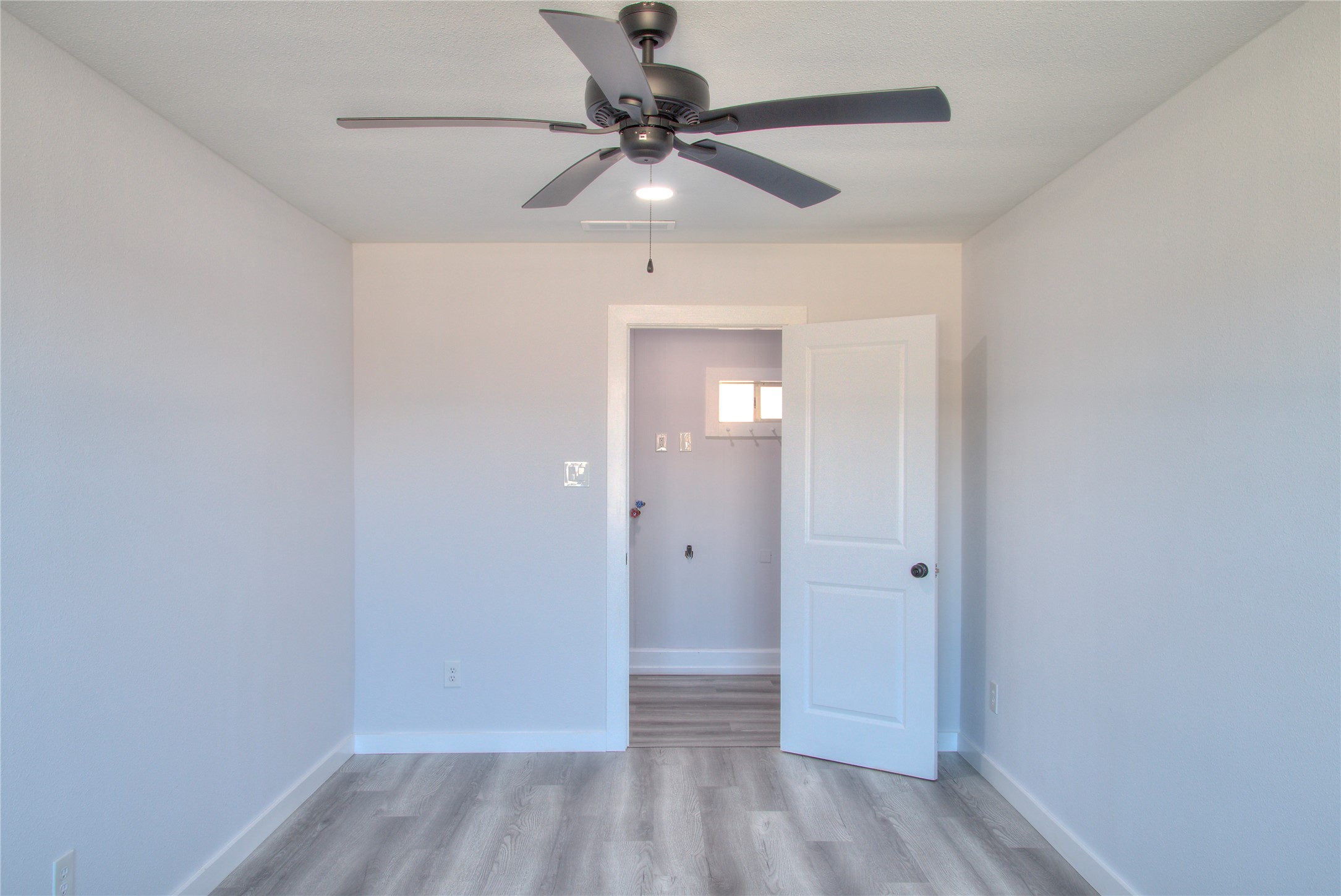 Cozy secondary bedroom featuring a spacious walk-in closet.