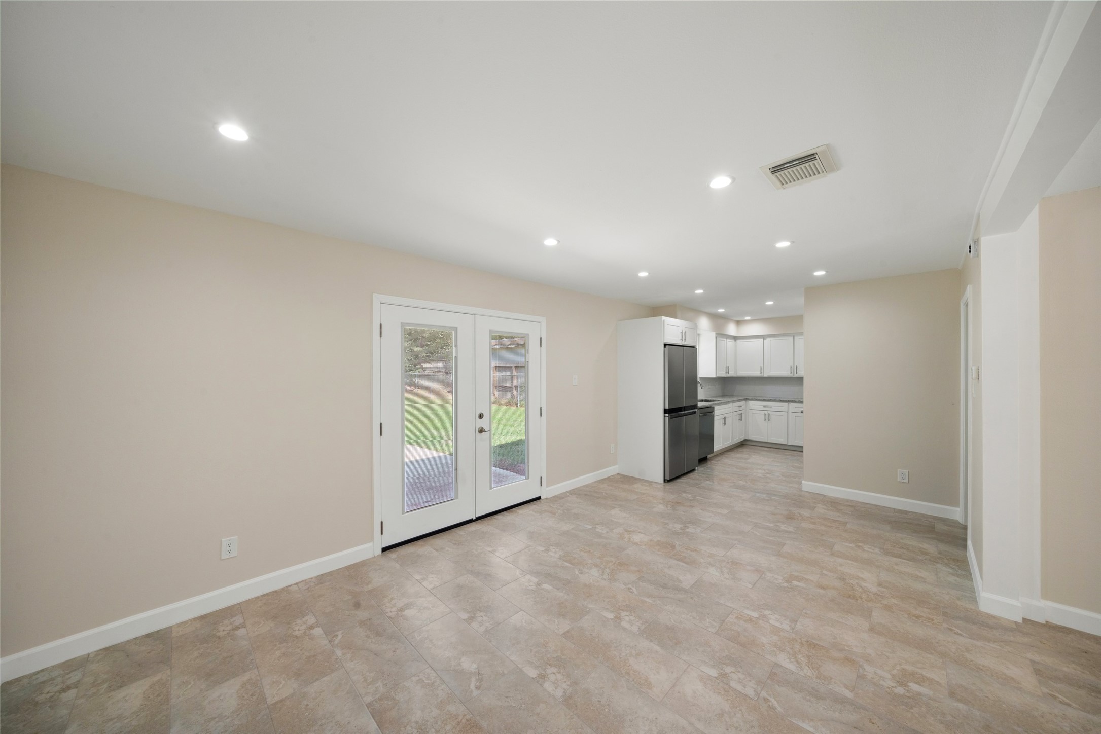 Another view of the living space, Kitchen is there right to the right. This open connection gives the room an easy space for entertaining and being in the middle of the action.
