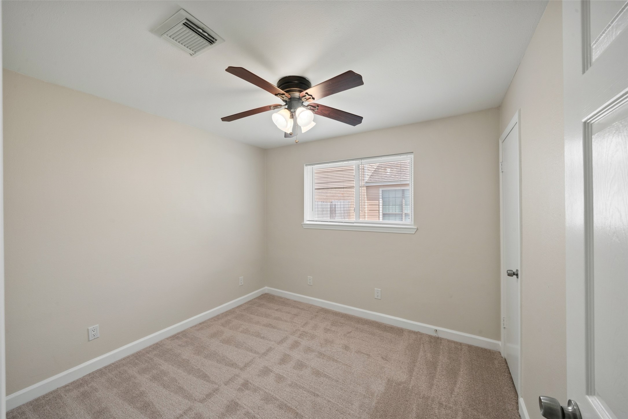 Secondary Bedroom; new carpeting, mini blinds and fresh paint on walls and baseboards.