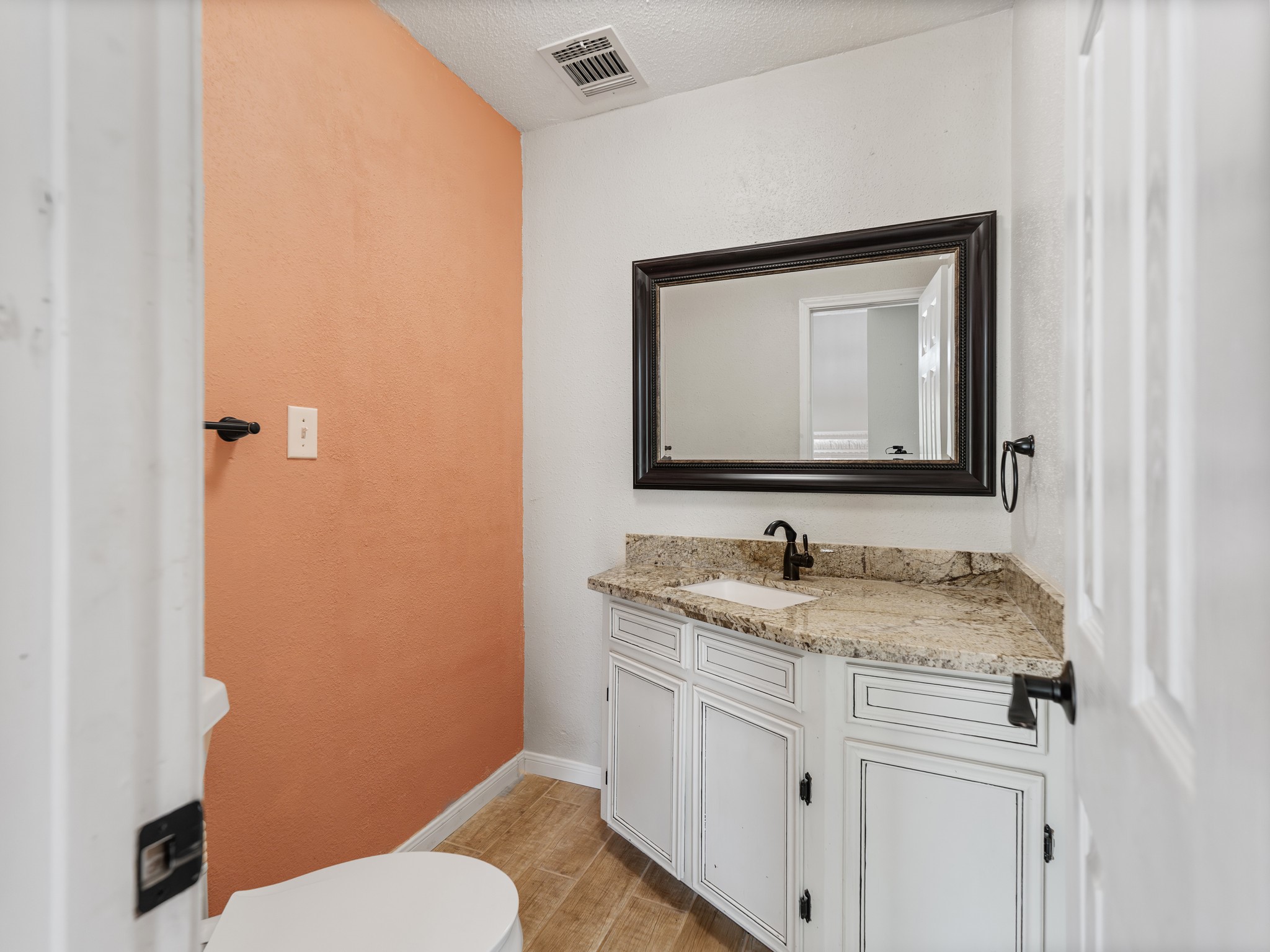 1/2 bath located off the living area