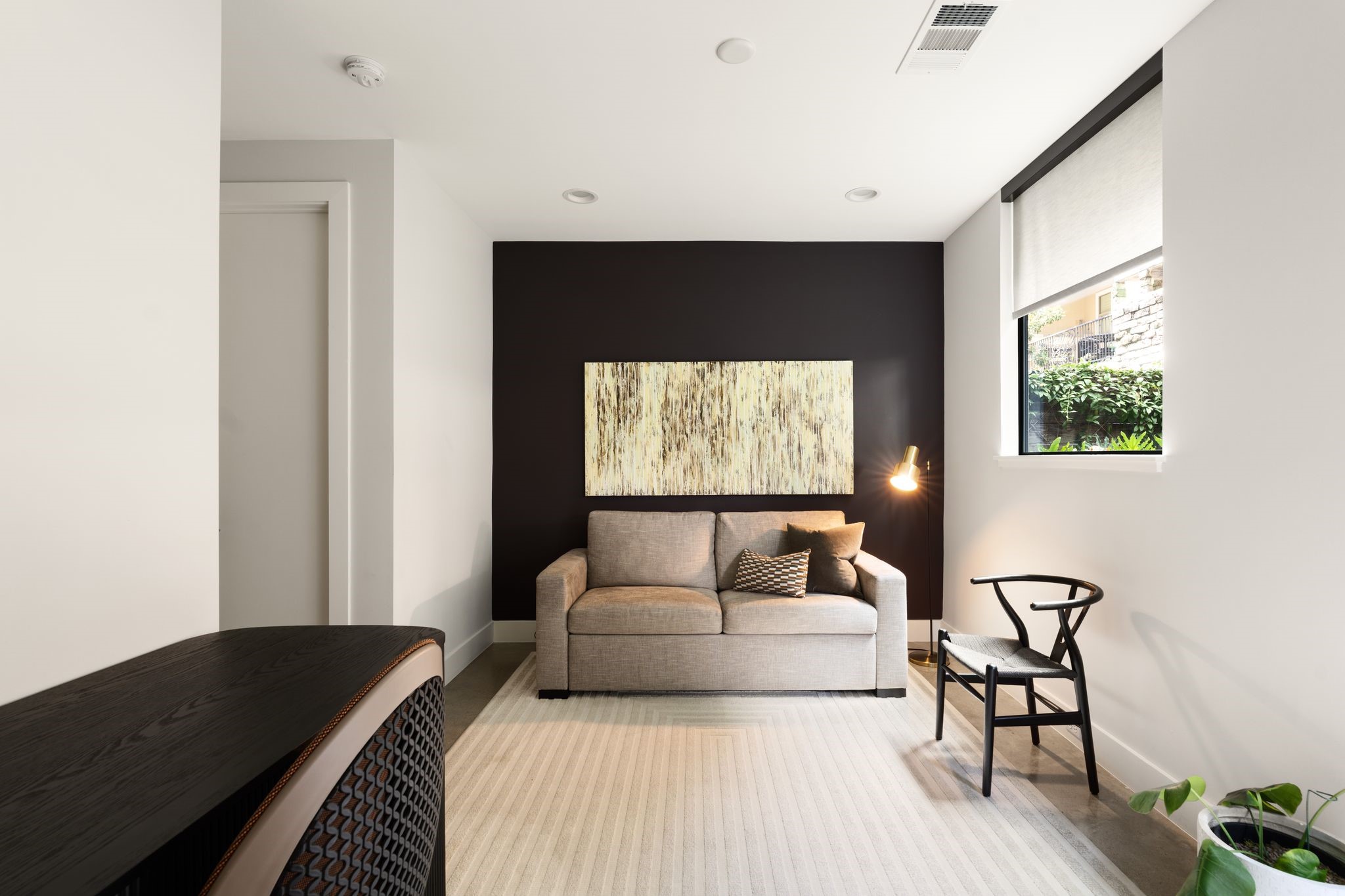 Another view of the flexible first-floor bedroom, complete with generous proportions and a step-in closet for additional storage.