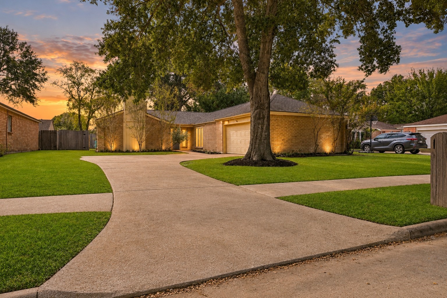 Welcome to this warm and inviting single-story residence, beautifully set back on an expansive front lot that feels like home the moment you arrive. A sweeping, curved driveway provides generous parking for family and guests, creating a grand yet friendly approach to the house.