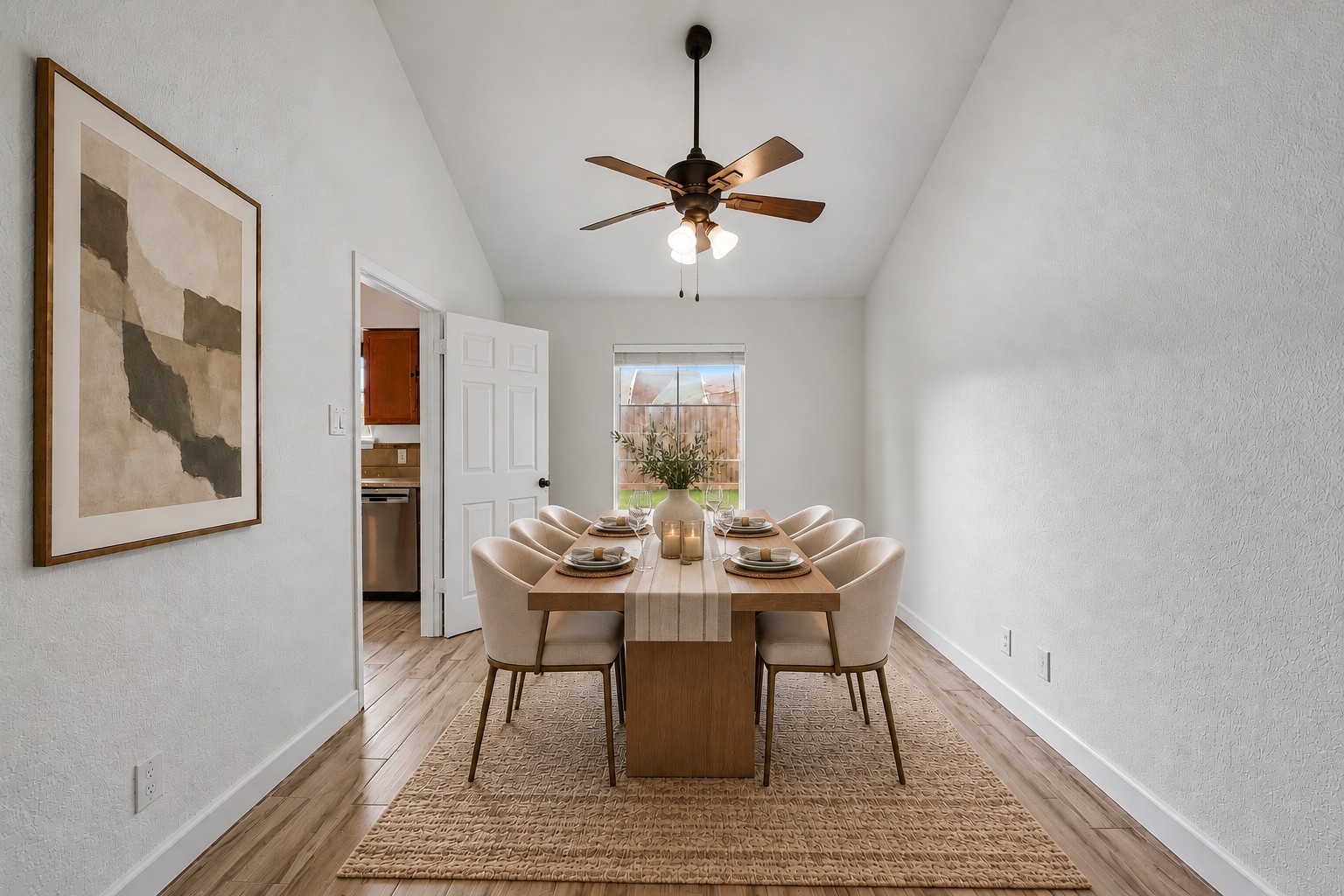 Virtually Staged: Dramatic vaulted ceilings elevate this dedicated formal dining room, creating an open and welcoming ambiance tailored for hosting memorable dinners.