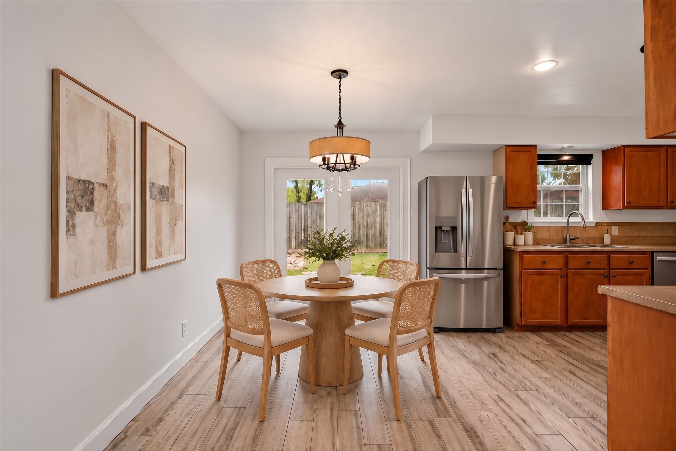 Virtually Staged: Bright and comfortable, this open breakfast nook balances functional dining space with delightful backyard views. Virtually Staged: Bright and comfortable, this open breakfast nook balances functional dining space with delightful backyard views.