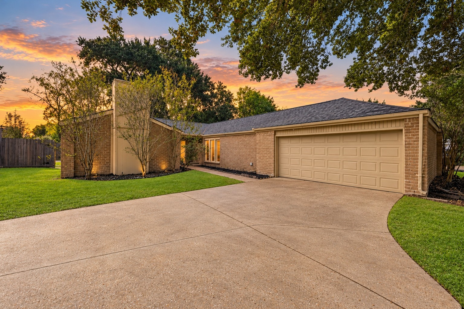 The home's layout incorporates classic exterior angles and an integrated chimney accent, with soft foundation lighting that beautifully illuminates the masonry as evening falls. The home's layout incorporates classic exterior angles and an integrated chimney accent, with soft foundation lighting that beautifully illuminates the masonry as evening falls.