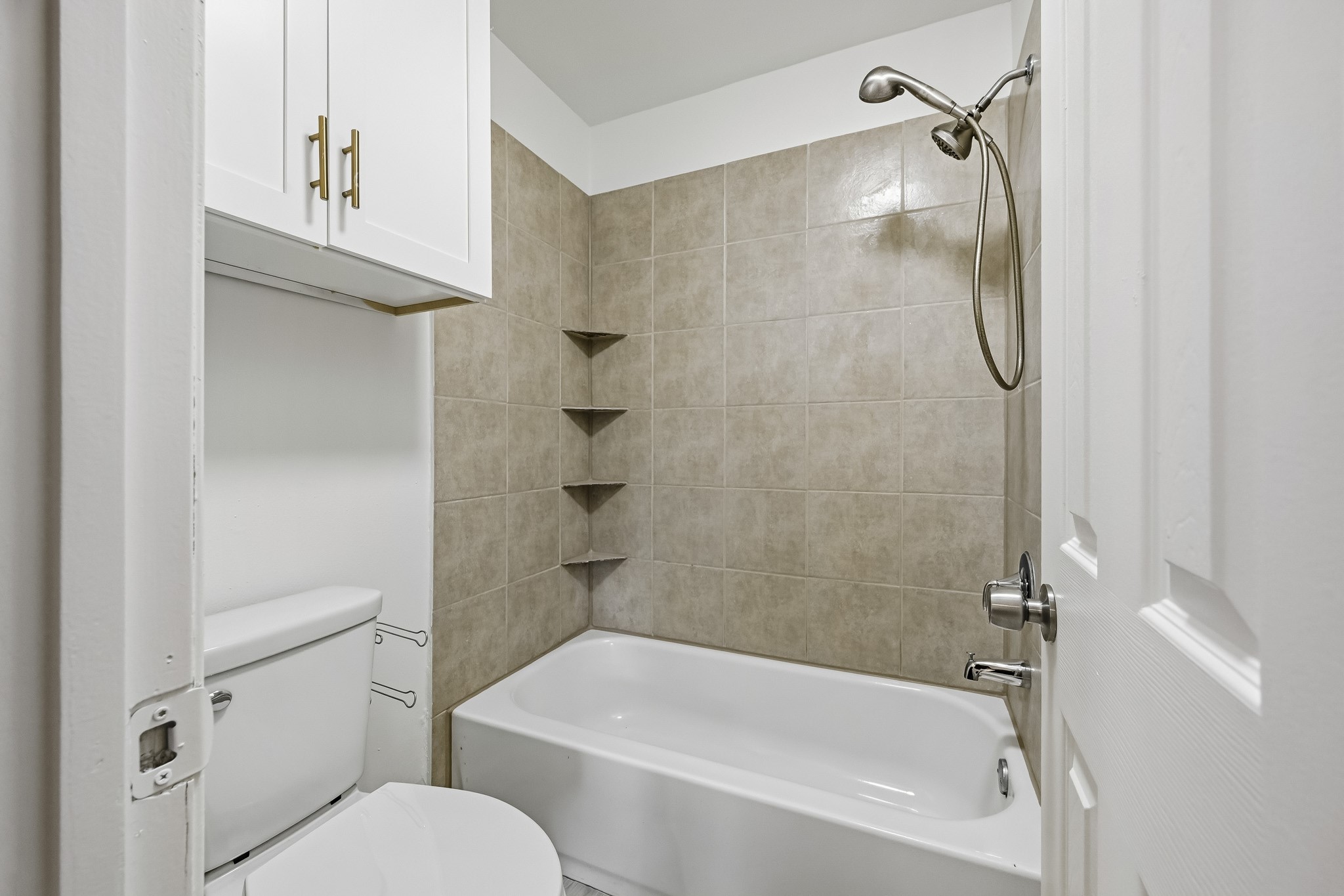 Paired with upgraded plumbing hardware and a spacious upper vanity cabinet for extra linens and essentials, the room delivers a welcoming, practical setting to unwind.