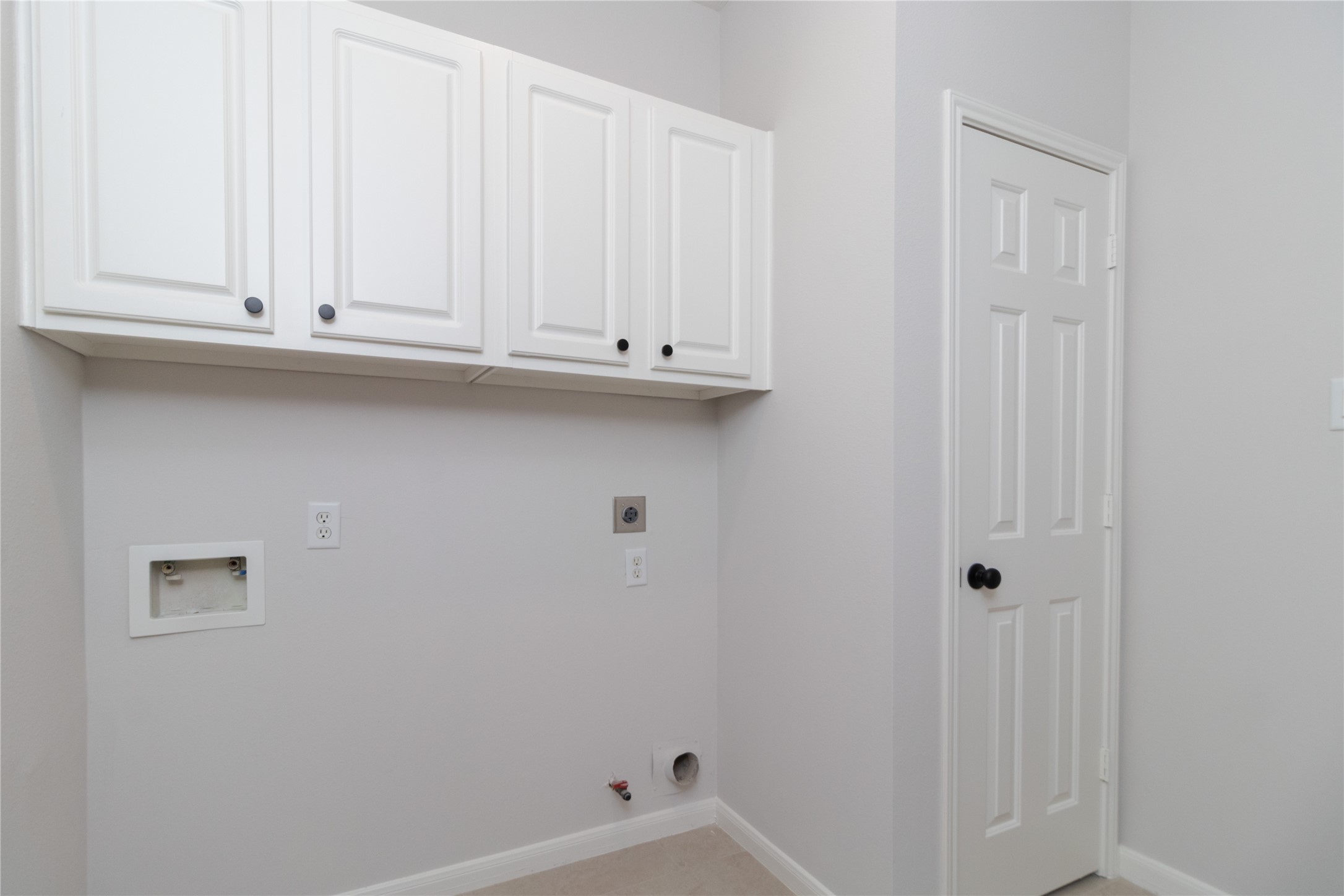 Utility Room with gas and electric dryer connections.