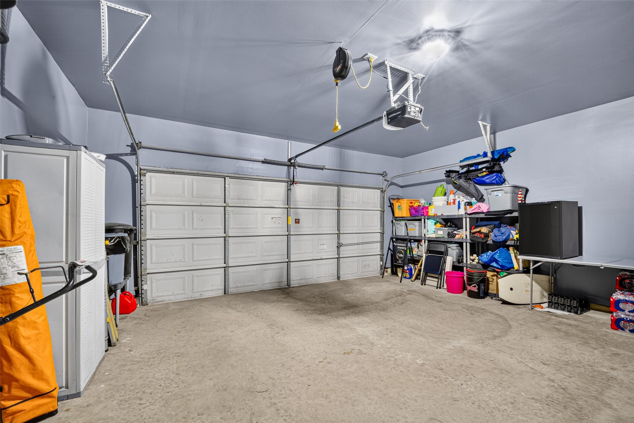 Oversized two-car garage with room for storage and projects.