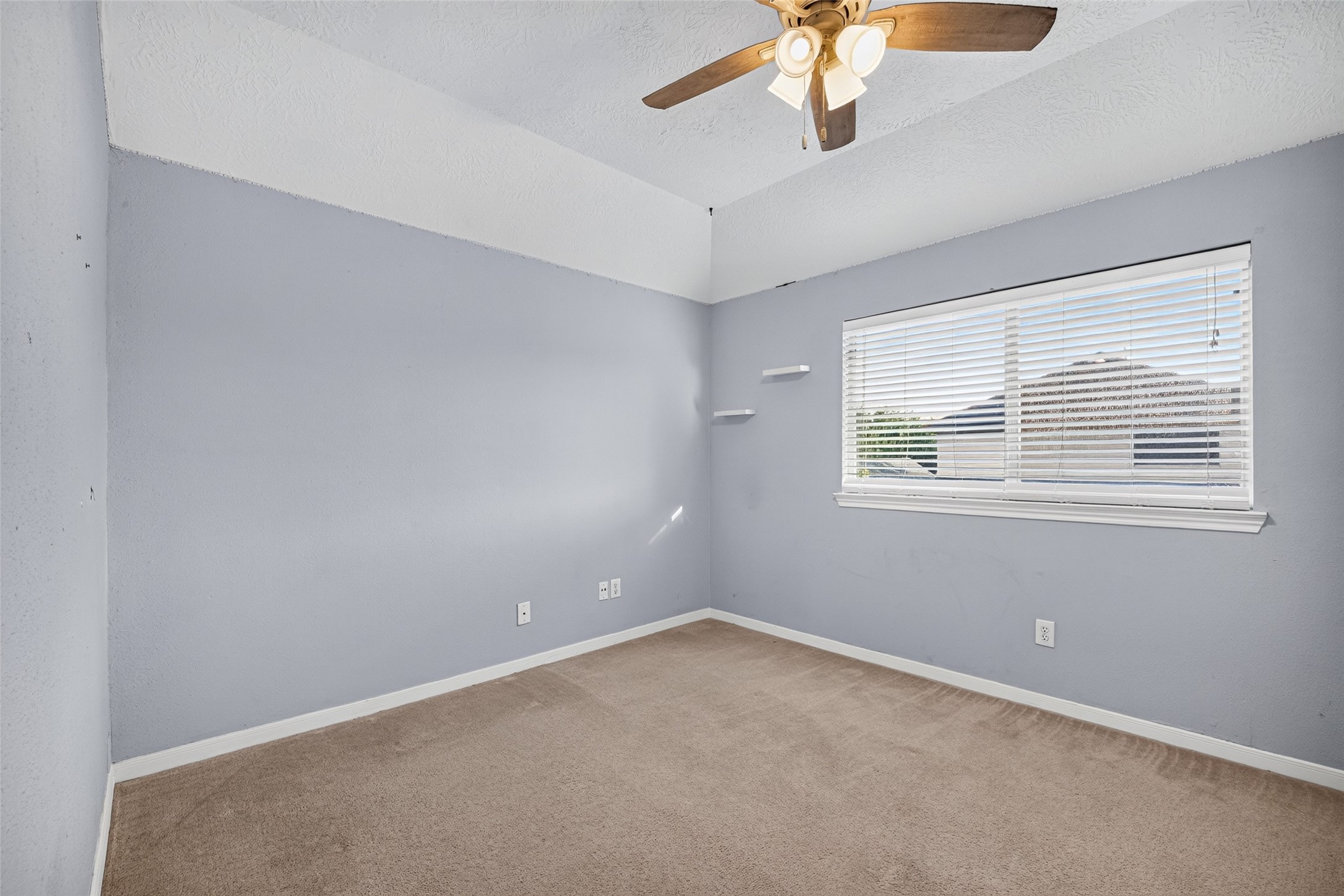 Bright flex room  imagine it as a nursery, studio, or gym.