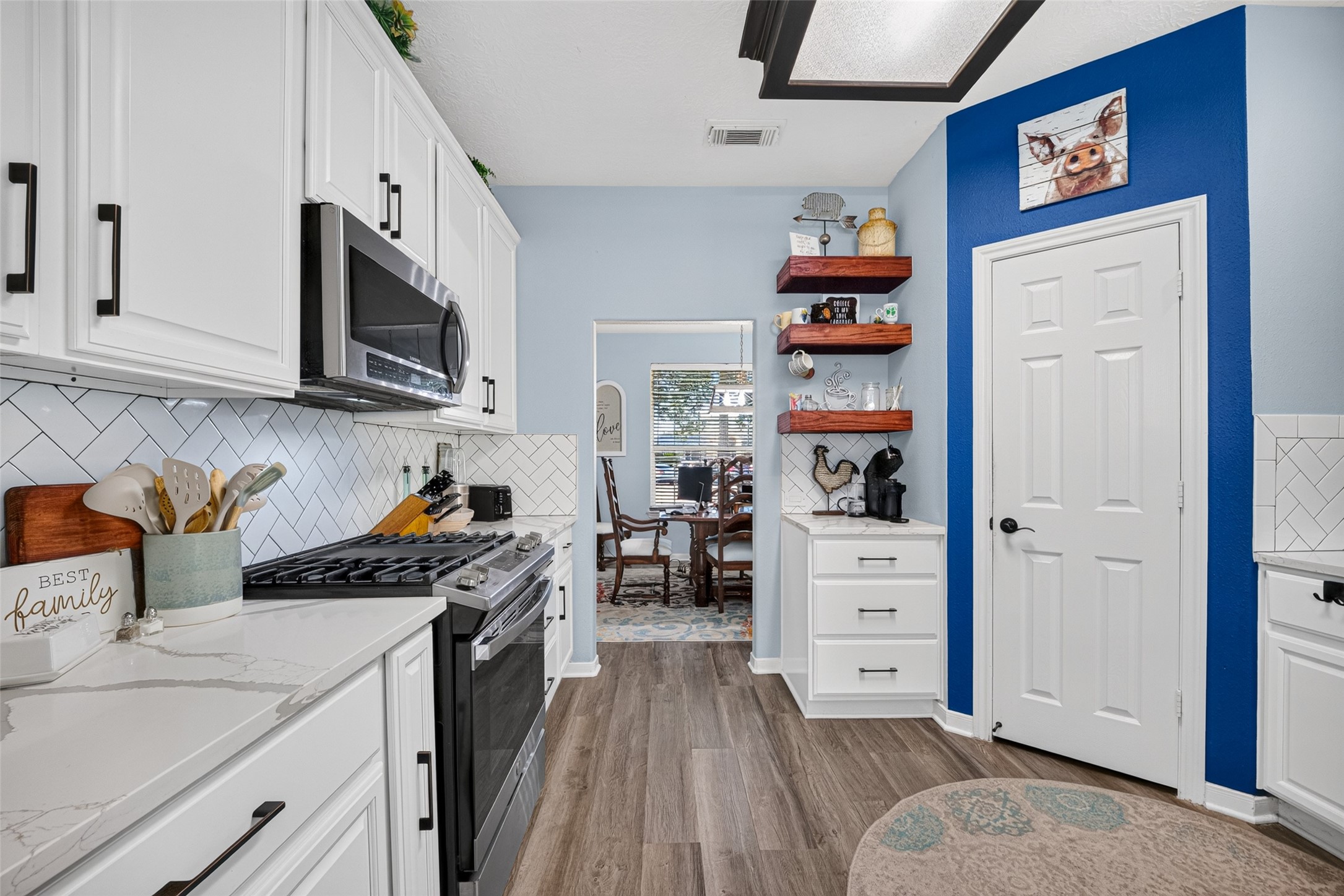 Open kitchen flowing into the dining area  built for hosting.