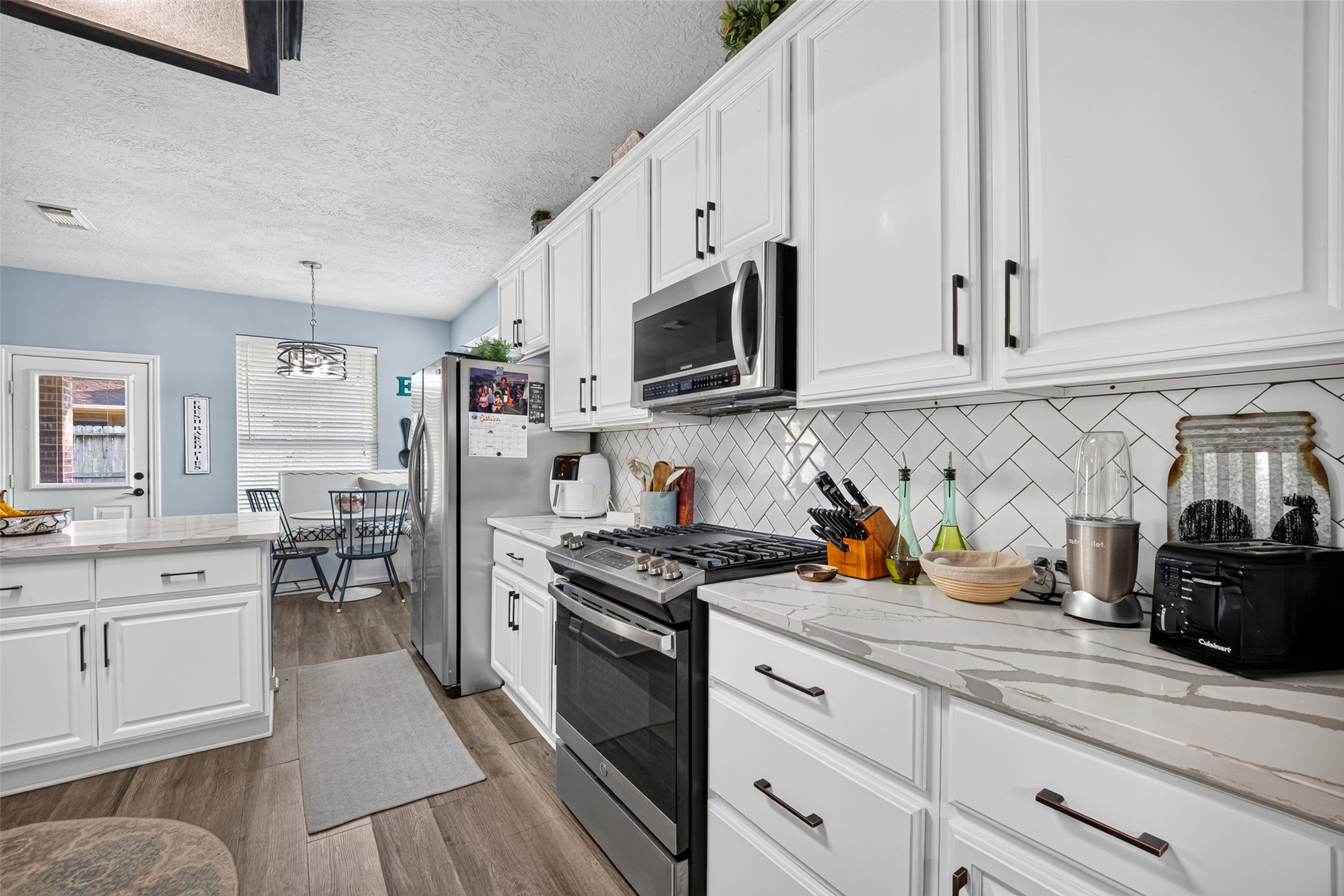 Well-laid-out kitchen with generous cabinetry and counter space.