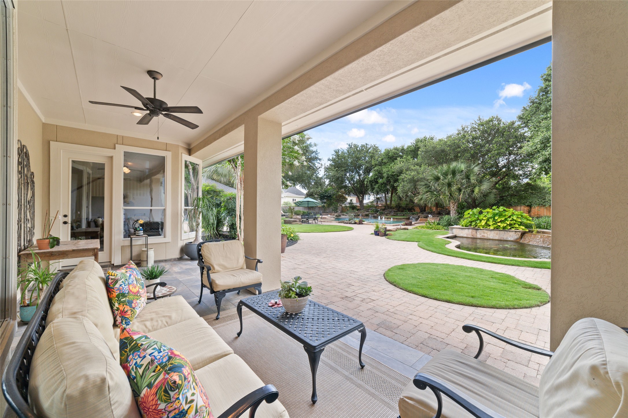 Covered patio perfect for enjoying the sounds of the waterfall from the koi pond.
