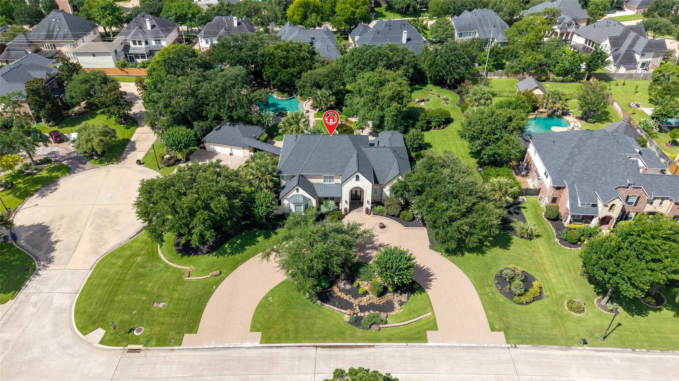 Aerial view showcases the large circular driveway.